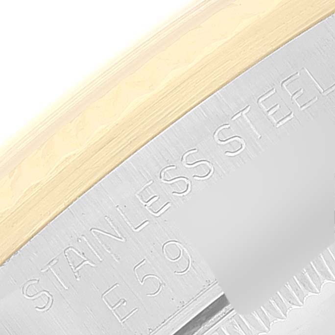 Close-up of a Mid-Size Rolex watch case focusing on the stainless steel and partial serial number.