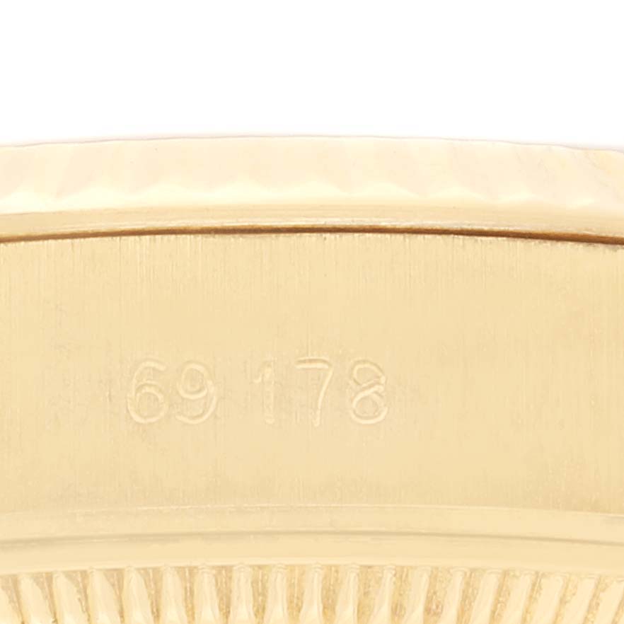 This image shows a close-up of the side of a Rolex President 69178 Women
s Yellow Gold Champagne Dial 69178 Women
s Yellow Gold Champagne Dial model watch, focusing on the model number engraving.