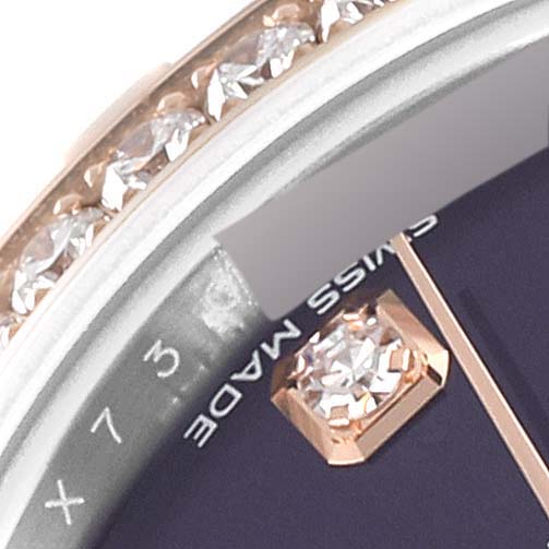 This close-up image of a Rolex Datejust 279381 Women's Stainless Steel Purple Dial 279381 Women's Stainless Steel Purple Dial watch shows the bezel with diamonds and part of the dial with a diamond hour marker and "Swiss Made" text.