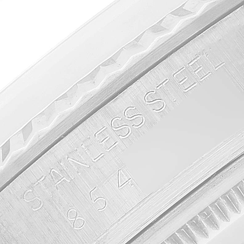 This close-up image shows the stainless steel bezel of the Rolex Vintage Collection 16014 Men's Stainless Steel Silver Dial 16014 Men's Stainless Steel Silver Dial model, highlighting its textured edge and engraved serial number.