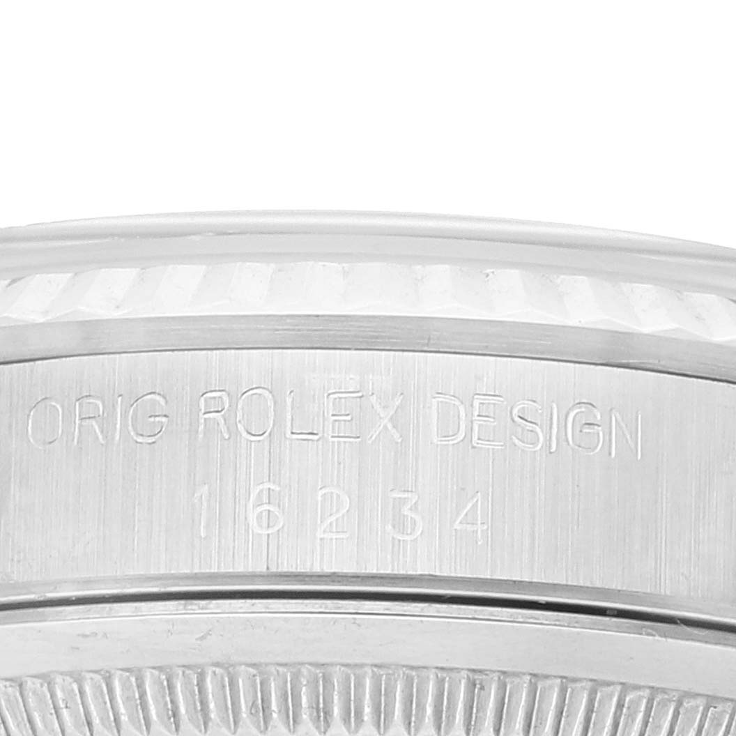 This image shows a close-up view of the engraved caseback of a Rolex Datejust 16234 Men's Stainless Steel Silver Dial 16234 Men's Stainless Steel Silver Dial model.