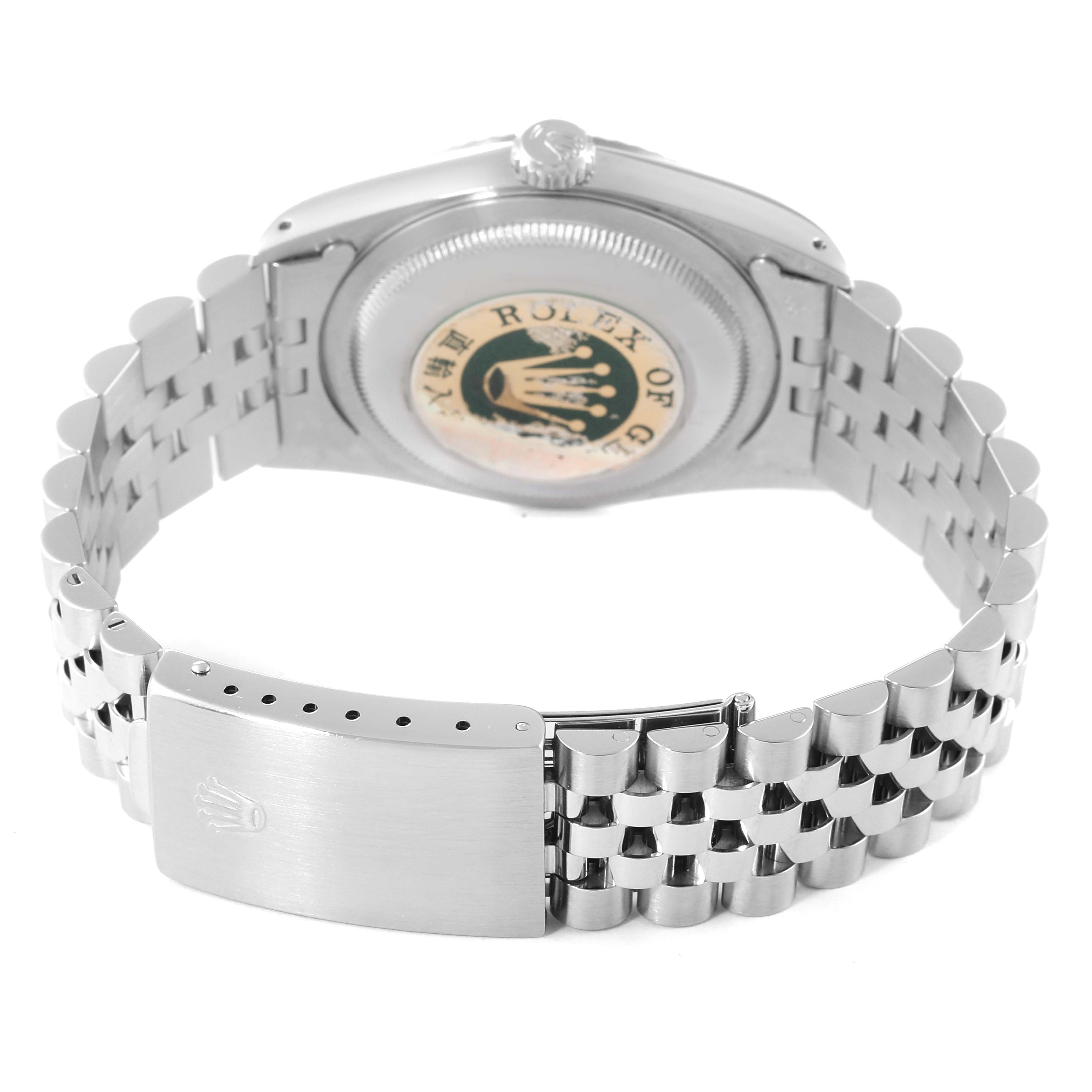 This Rolex Datejust 16234 Men's Stainless Steel Silver Dial 16234 Men's Stainless Steel Silver Dial watch is shown from the back, displaying its case back, crown, and Jubilee bracelet with the clasp.