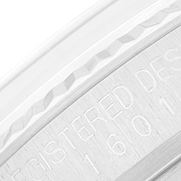 This is a close-up of the bezel and case band, showing the engraved serial number on the Rolex Vintage Collection 1601 Men's Stainless Steel White Dial 1601 Men's Stainless Steel White Dial model.