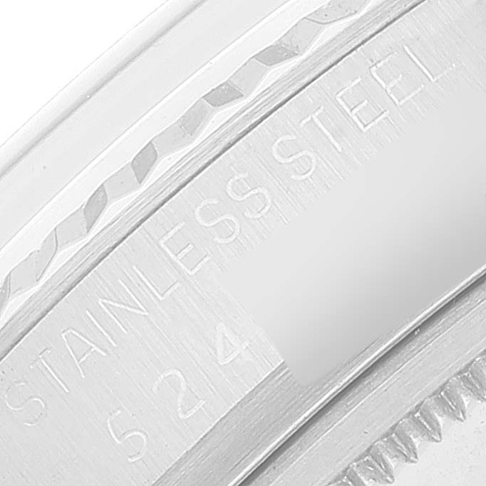 This close-up image shows the case back of a Rolex Vintage Collection 1601 Men's Stainless Steel White Dial 1601 Men's Stainless Steel White Dial watch, highlighting the "Stainless Steel" engraving.