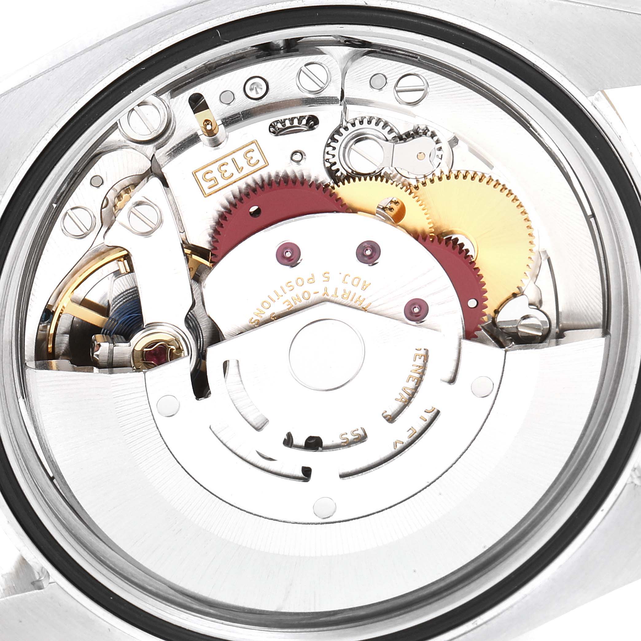 This image shows the internal mechanism of a Rolex Datejust 116233 Men's Steel and Gold (two tone) Black Dial 116233 Men's Steel and Gold (two tone) Black Dial watch, highlighting gears and movement components from a back angle.