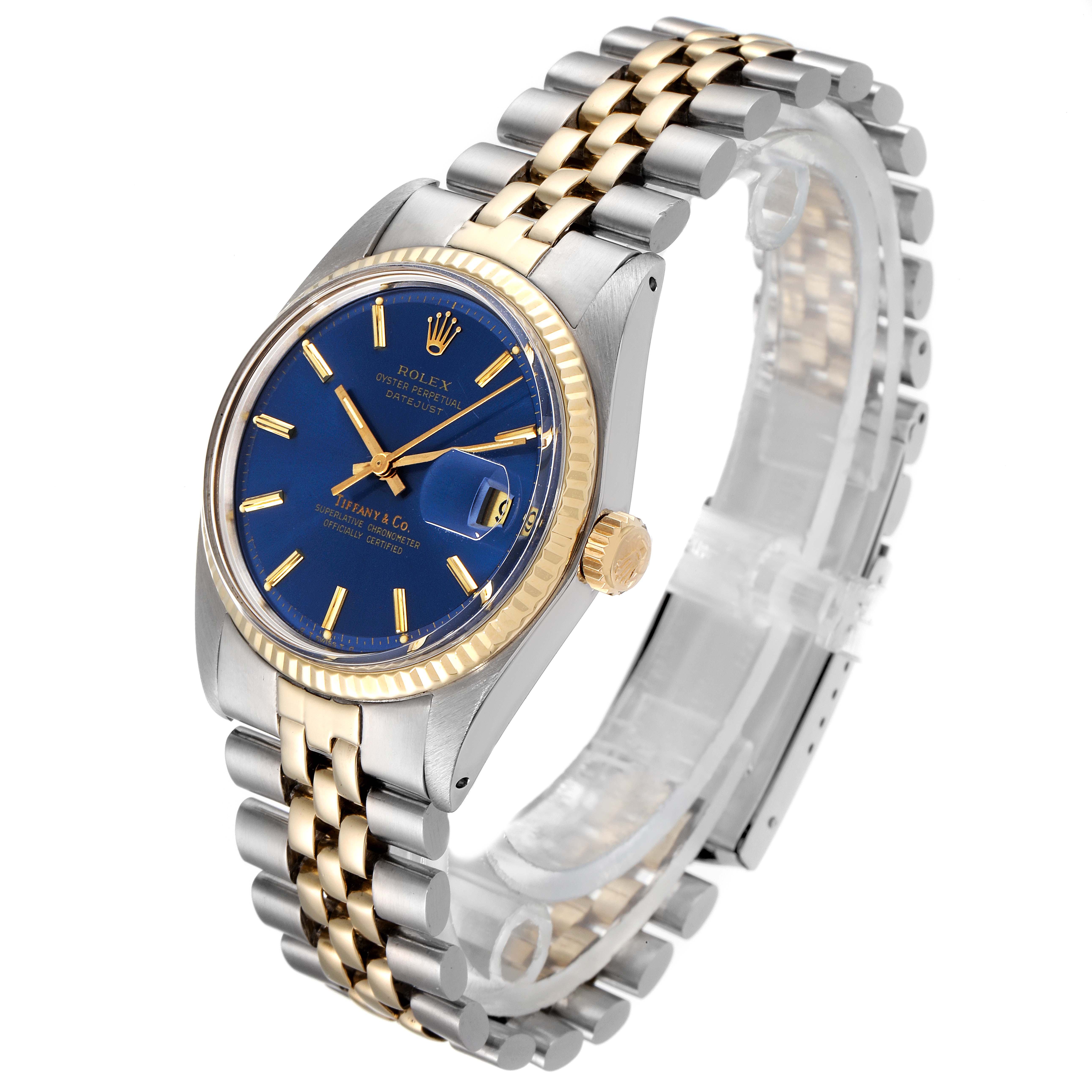 The image shows a Rolex Vintage Collection 1601 Men's Steel and Gold (two tone) Blue Dial 1601 Men's Steel and Gold (two tone) Blue Dial watch, angled slightly above and to the side, highlighting its blue dial, gold bezel, and two-tone bracelet.