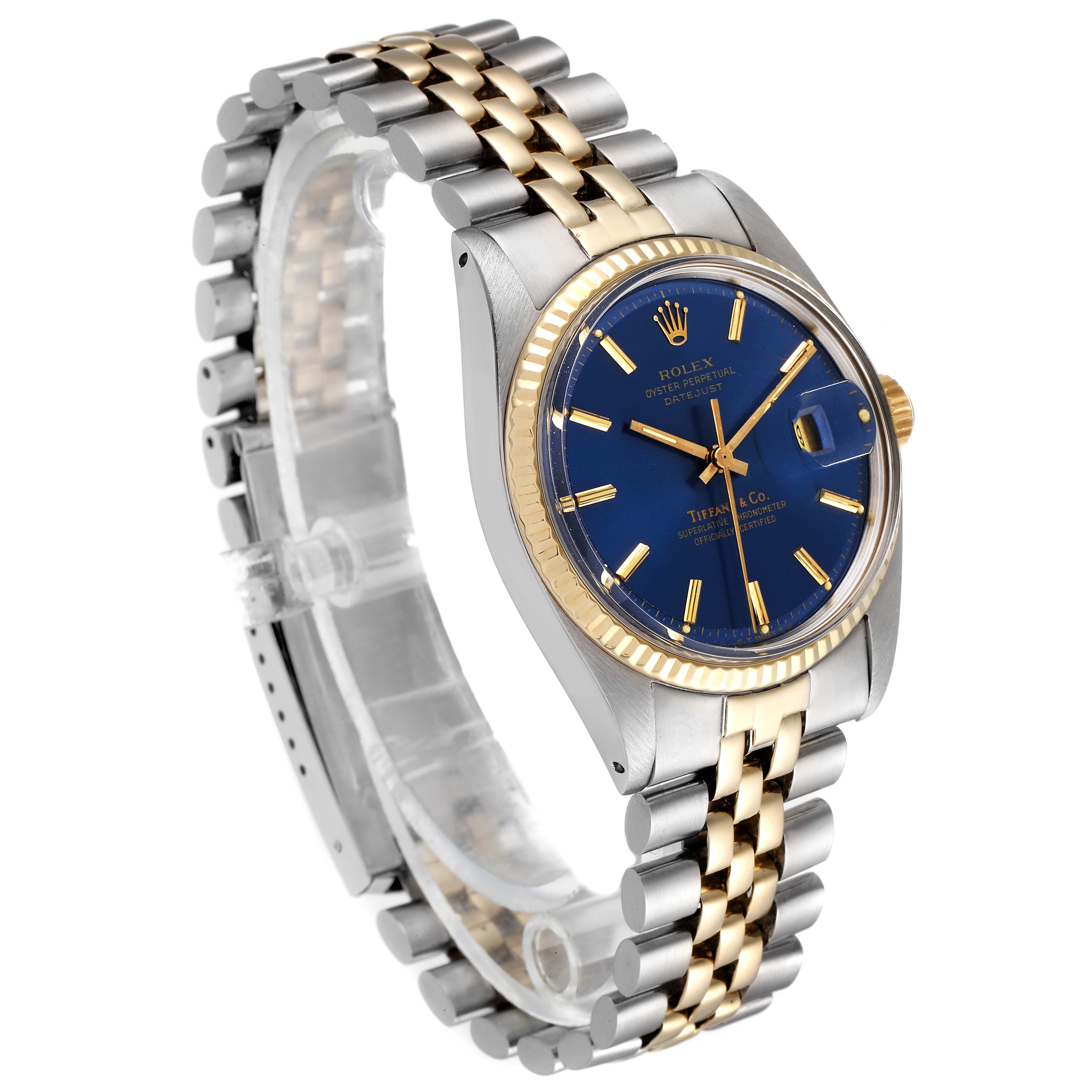 The Rolex Vintage Collection 1601 Men's Steel and Gold (two tone) Blue Dial 1601 Men's Steel and Gold (two tone) Blue Dial watch is shown in a side angle, displaying its blue dial, two-tone bracelet, and fluted bezel.