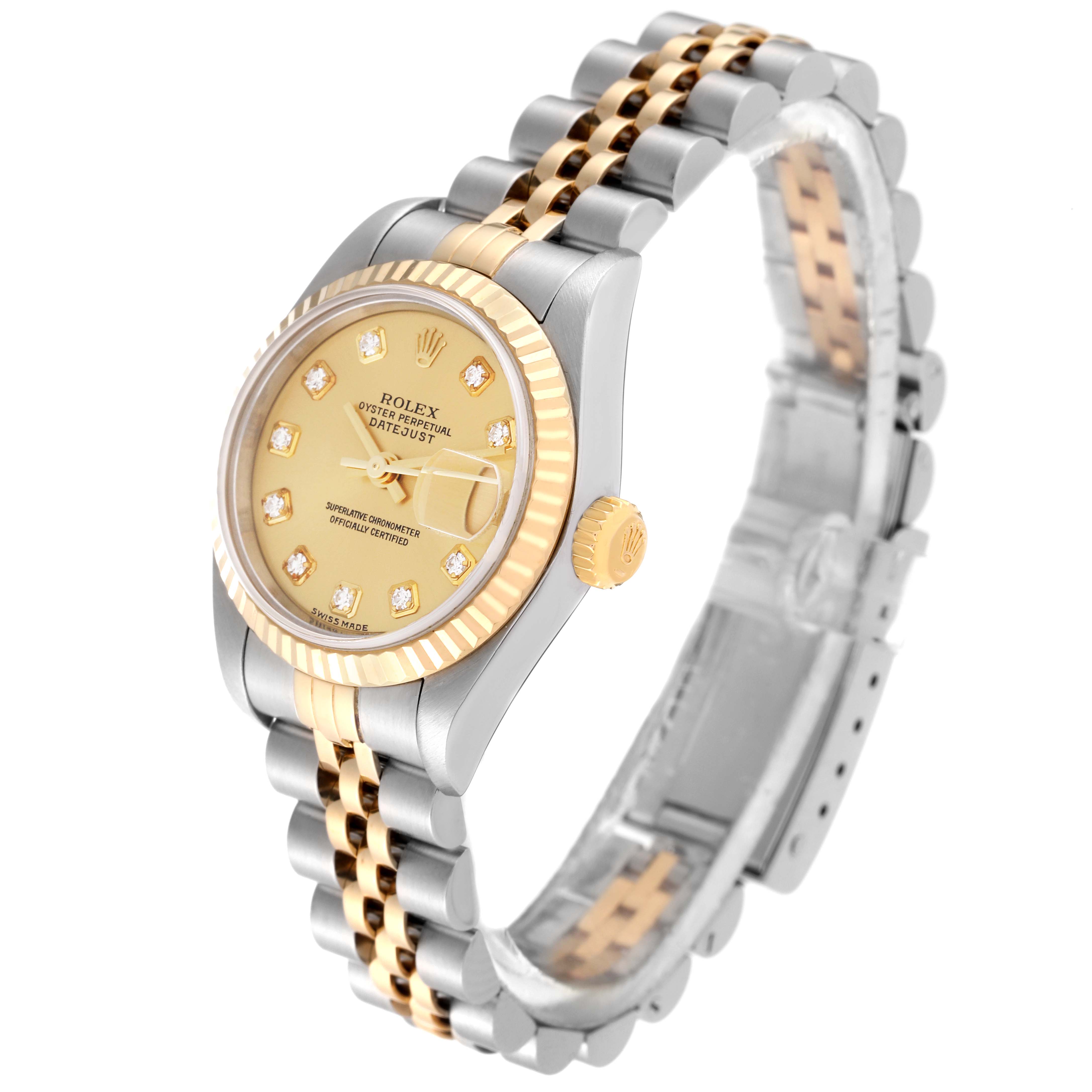 The image shows a Rolex Datejust 79173 Women's Steel and Gold (two tone) Champagne Dial 79173 Women's Steel and Gold (two tone) Champagne Dial watch, focusing on its gold and silver bracelet, gold fluted bezel, and diamond-set dial, at an oblique angle.