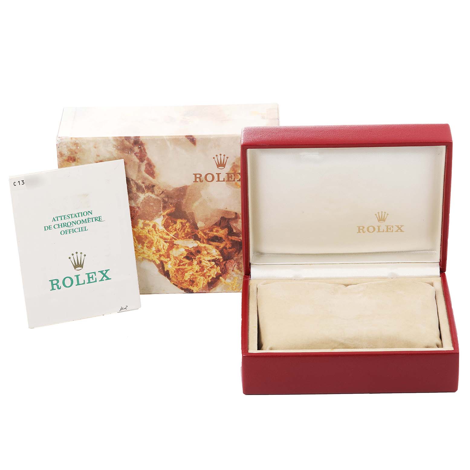 The image shows the packaging accessories for a Rolex Datejust 69173 Women's Steel and Gold (two tone) Champagne Dial 69173 Women's Steel and Gold (two tone) Champagne Dial, including an official certificate, outer box, and inner presentation case.