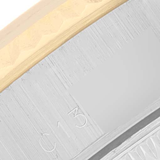 This close-up image shows part of the bezel and case of a Rolex Datejust 69173 Women's Steel and Gold (two tone) Champagne Dial 69173 Women's Steel and Gold (two tone) Champagne Dial watch.