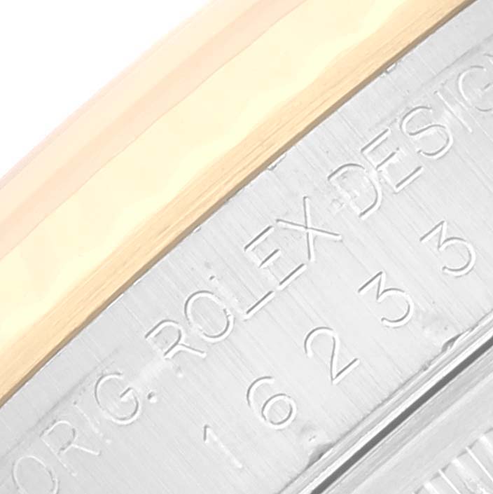 This image shows a close-up of the side of the Rolex Datejust 16233 Men's Steel and Gold (two tone) Beige Dial 16233 Men's Steel and Gold (two tone) Beige Dial watch case, displaying the engraved model number.