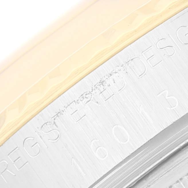This image shows a close-up of the outer edge of the bezel and engraved case of a Rolex Vintage Collection 16013 Men's Steel and Gold (two tone) White Dial 16013 Men's Steel and Gold (two tone) White Dial watch.