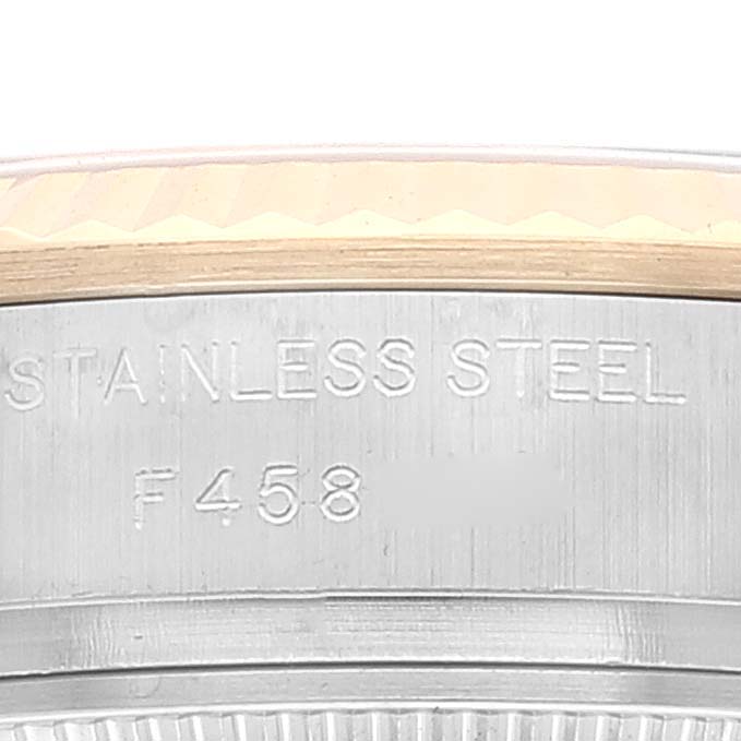 The image shows a close-up of the side of a Rolex Datejust 179173 Women's Stainless Steel White Dial 179173 Women's Stainless Steel White Dial watch case, highlighting the stainless steel material and part of the bezel.