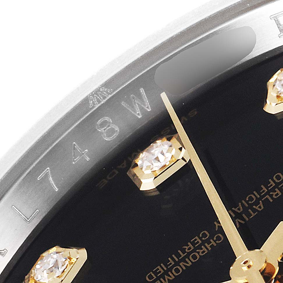 This image shows a close-up view of a Datejust Rolex watch face, featuring diamond hour markers and part of the watch dial inscription.
