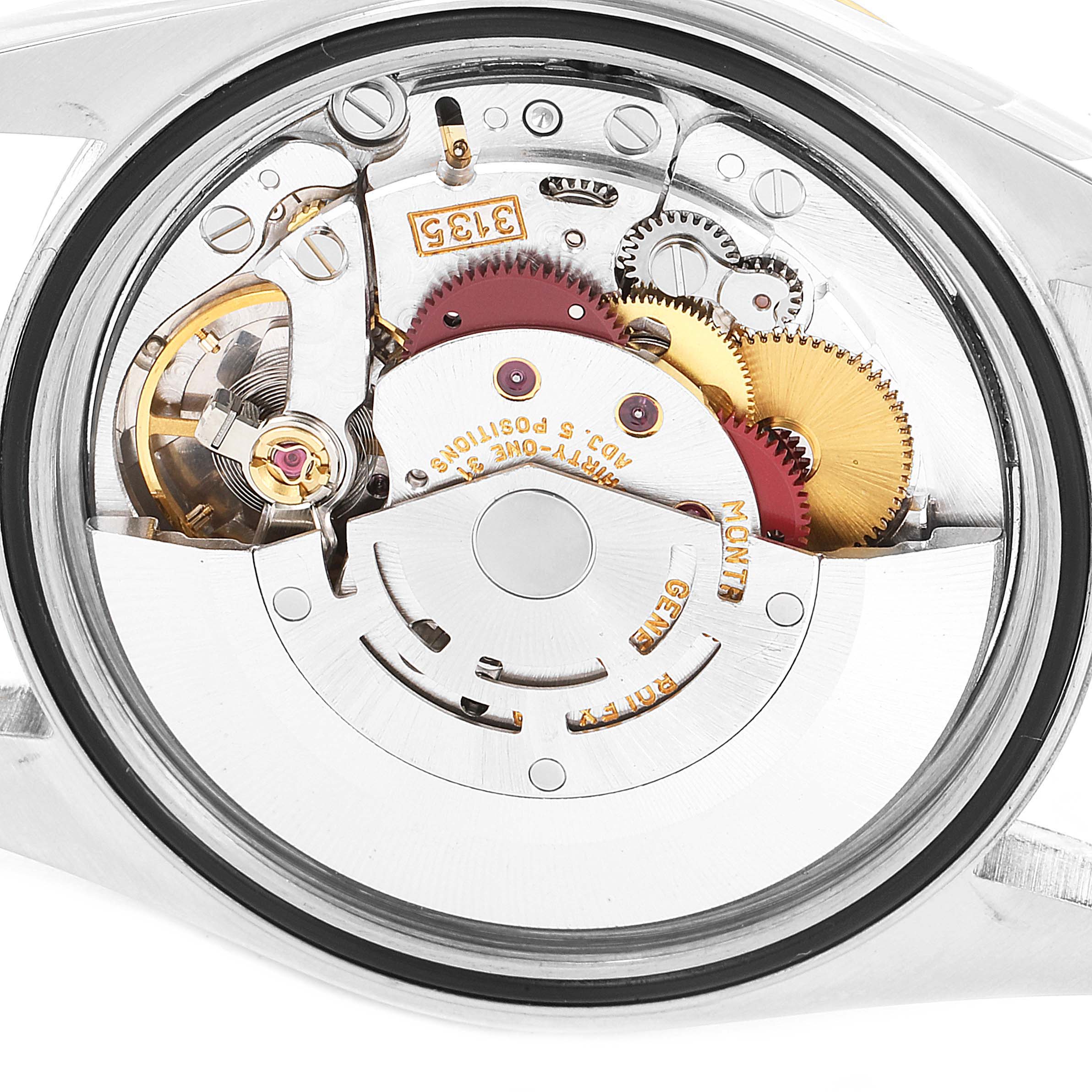 This image shows a close-up of the movement inside a Rolex Datejust 16233 Men's Steel and Gold (two tone) White Dial 16233 Men's Steel and Gold (two tone) White Dial watch, highlighting its intricate gears and mechanical components.