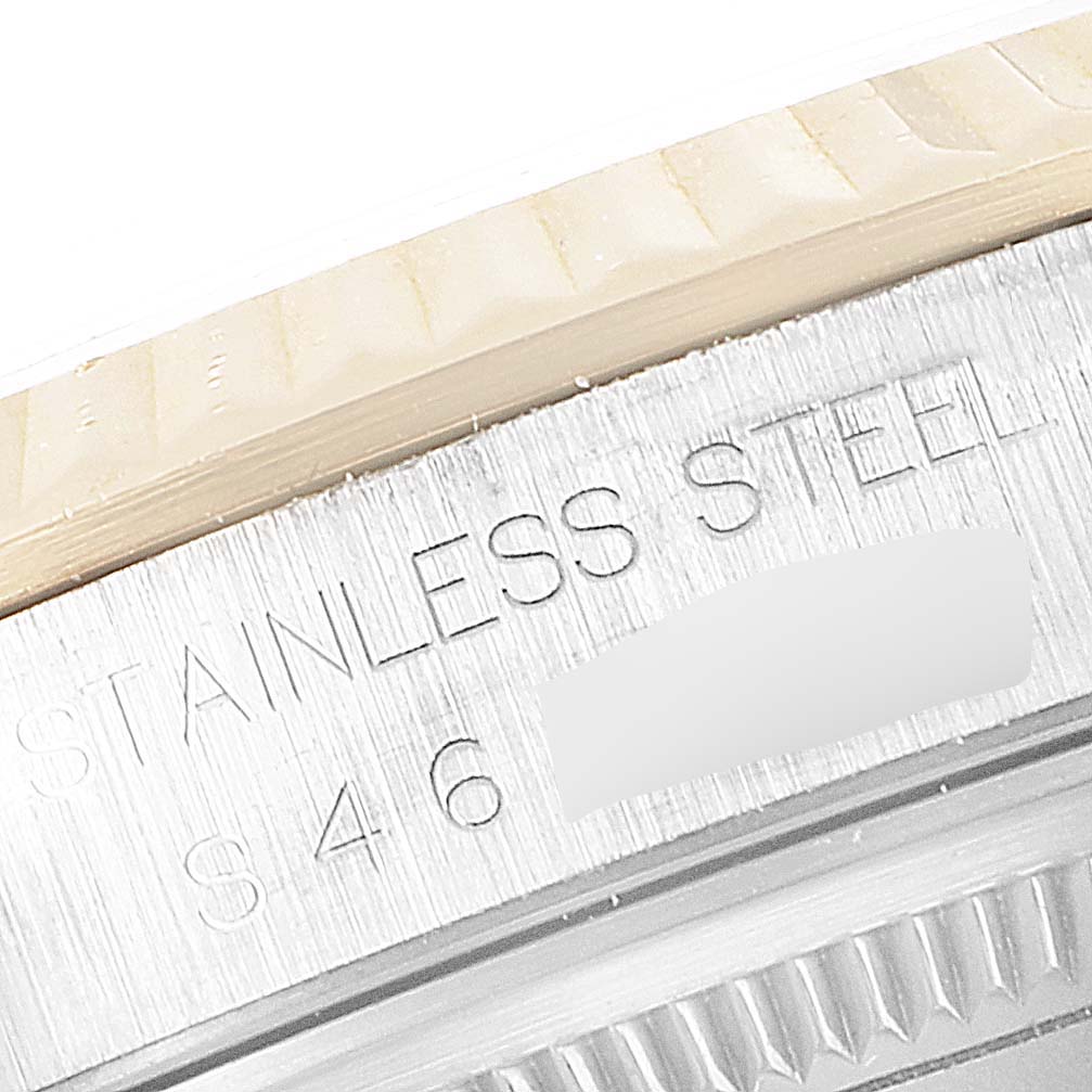 The image shows a close-up of the stainless steel case and bezel engraving on a Rolex Datejust 16233 Men's Steel and Gold (two tone) White Dial 16233 Men's Steel and Gold (two tone) White Dial watch.