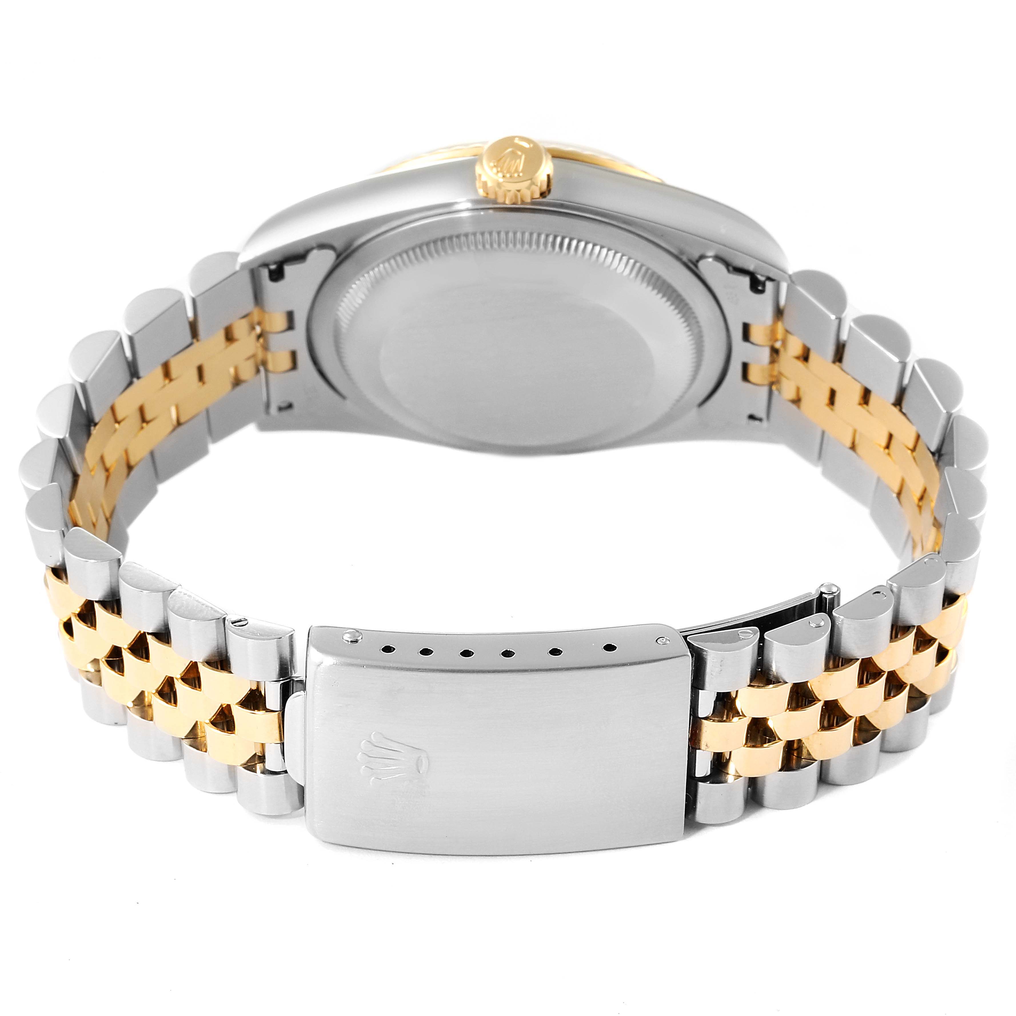 This image shows the back case and bracelet of a Rolex Datejust 16233 Men's Steel and Gold (two tone) White Dial 16233 Men's Steel and Gold (two tone) White Dial watch, featuring a two-tone metal design.