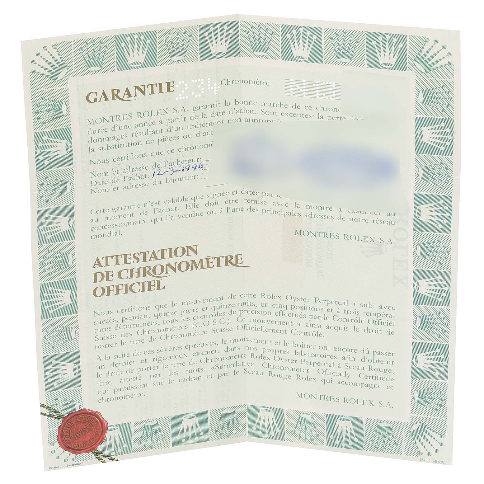 The image shows a close-up of the guarantee certificate for a Rolex Daytona 16523 Men's Steel and Gold (two tone) Black Dial 16523 Men's Steel and Gold (two tone) Black Dial watch.