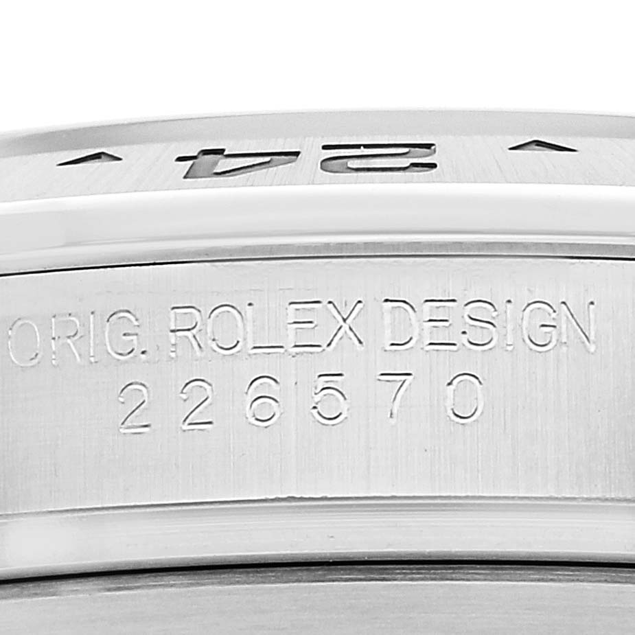 This image shows a close-up view of the serial number and "ORIG. ROLEX DESIGN" engraving on the side of the Rolex Explorer 226570 Men's Stainless Steel White Dial 226570 Men's Stainless Steel White Dial watch case.