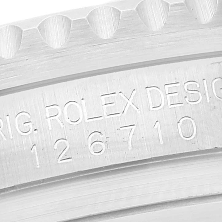 This is a close-up angle showing the model number "126710" engraved on the Rolex GMT-Master 126710 Men
s Stainless Steel Black Dial 126710 Men
s Stainless Steel Black Dial watch case.
