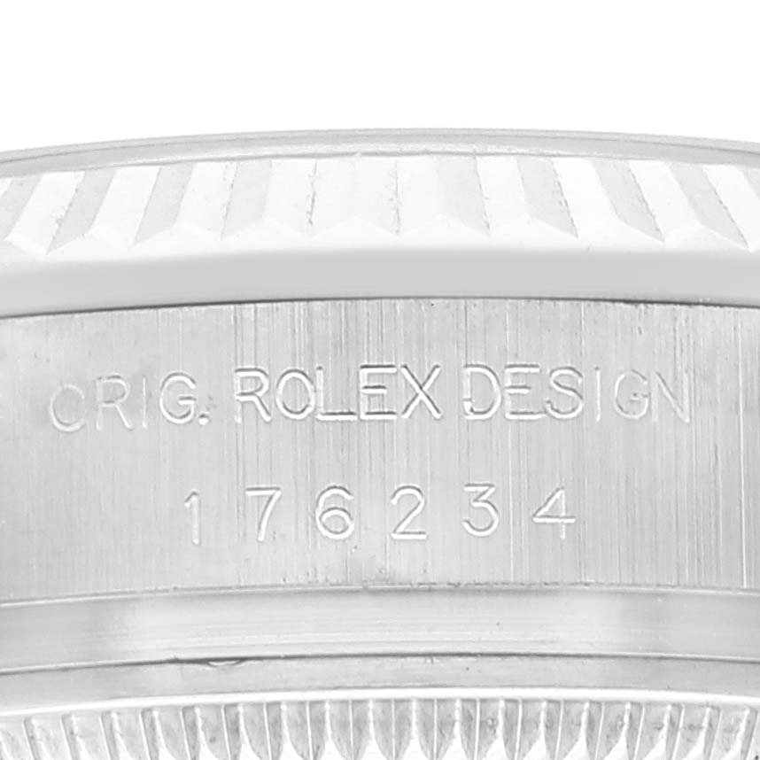 The image shows a close-up of the engraved side of a Rolex Oyster Perpetual 176234 Women
s Stainless Steel White Dial 176234 Women
s Stainless Steel White Dial watch, featuring the Rolex design and reference number.