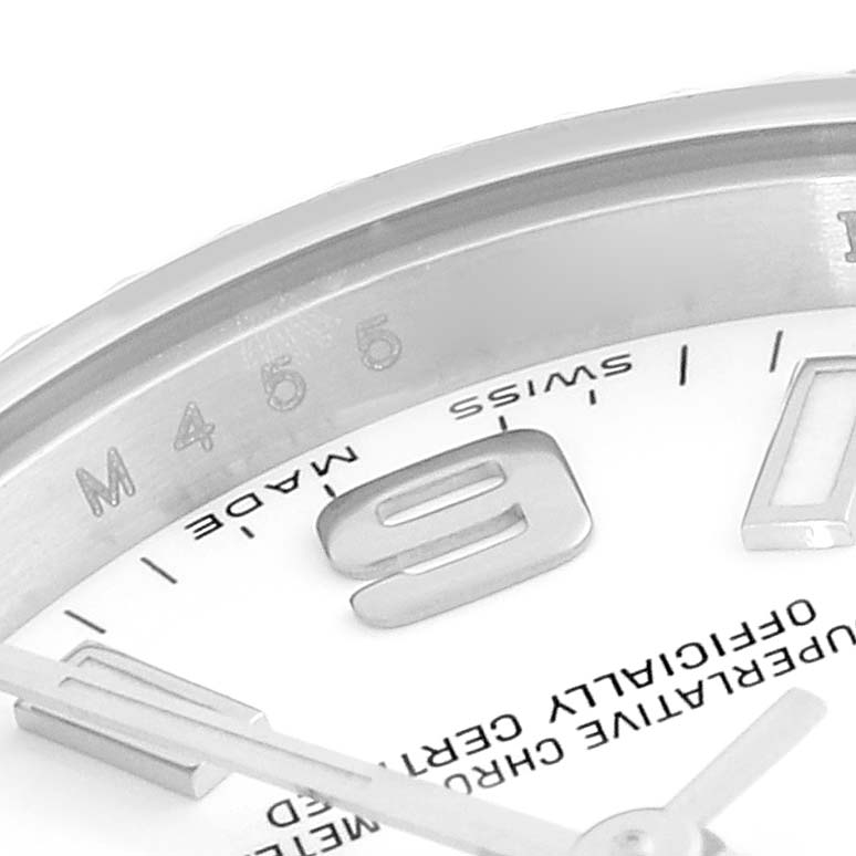 This close-up angle of the Rolex Oyster Perpetual 176234 Women
s Stainless Steel White Dial 176234 Women
s Stainless Steel White Dial watch shows part of the dial, numerals, and inner bezel markings.