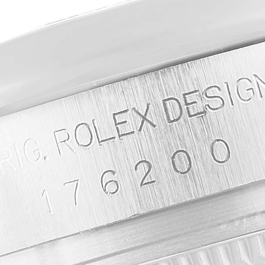 This image shows a close-up of the side of a Rolex Oyster Perpetual 176200 Women's Stainless Steel Black Dial 176200 Women's Stainless Steel Black Dial model, highlighting the engraving on the case.
