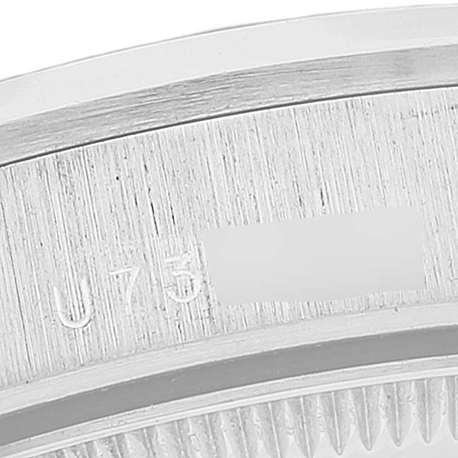 This image shows a close-up of the case back edge and serial number of a Rolex President 78246 Women's Platinum Black Dial 78246 Women's Platinum Black Dial model watch.