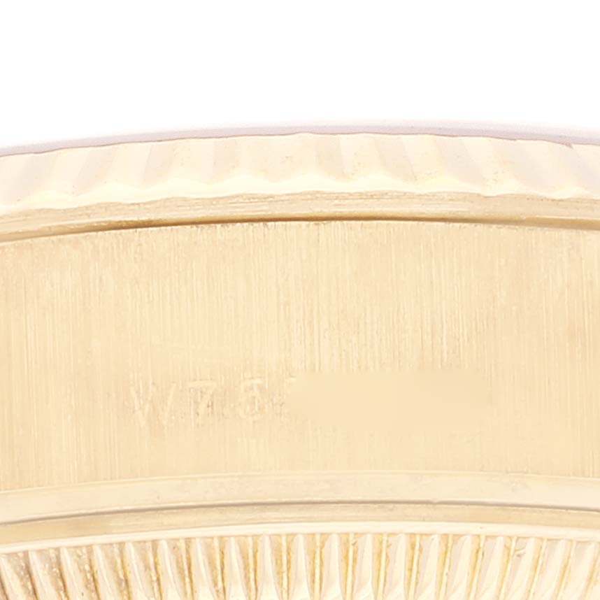 This close-up image shows the side view of the case and bezel of the Rolex President 69178 Women's Yellow Gold Champagne Dial 69178 Women's Yellow Gold Champagne Dial model watch.