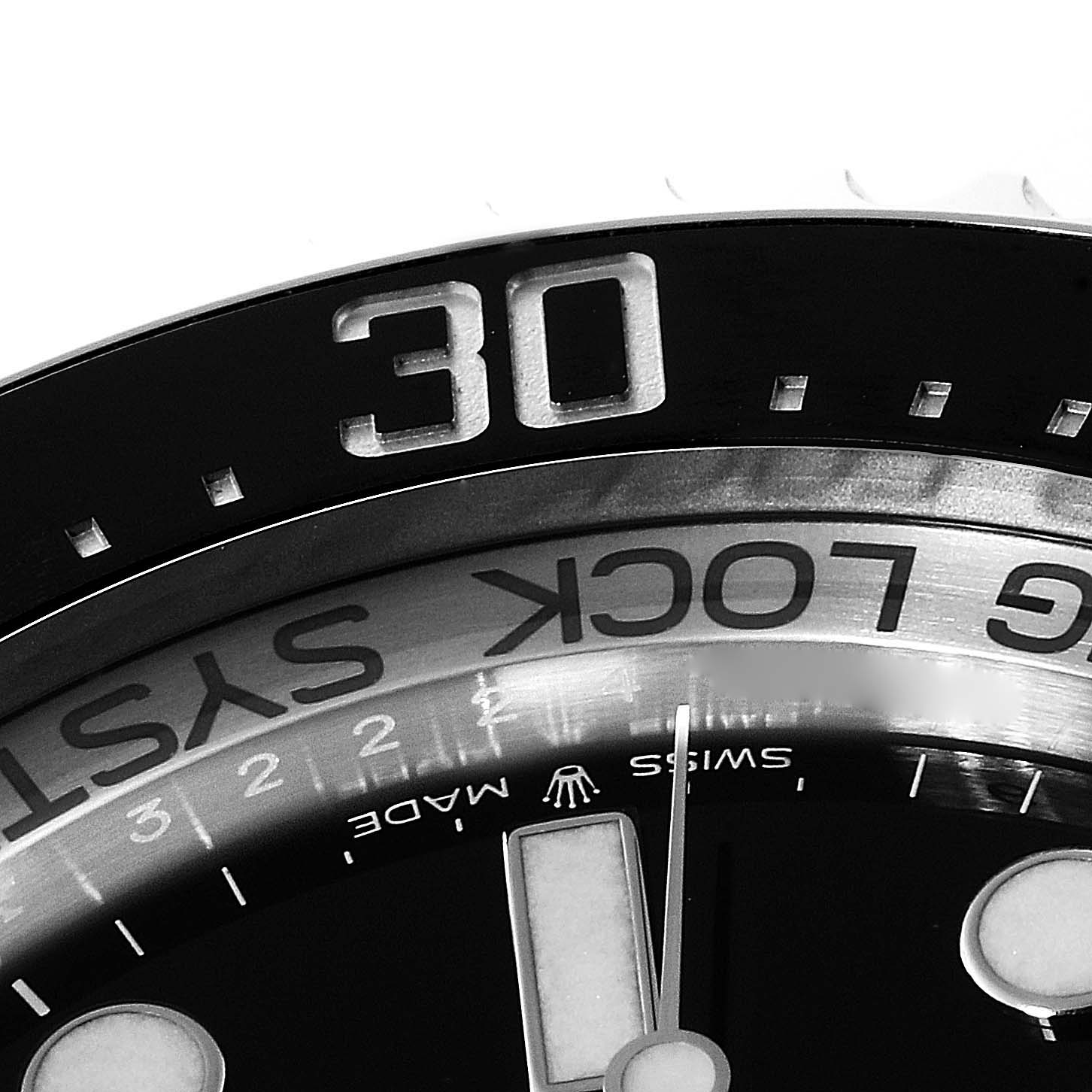 This image shows a close-up of the bezel and part of the dial of a Rolex Sea-Dweller 126660 Men
s Stainless Steel Blue Dial 126660 Men
s Stainless Steel Blue Dial watch, highlighting the 30-minute marker.