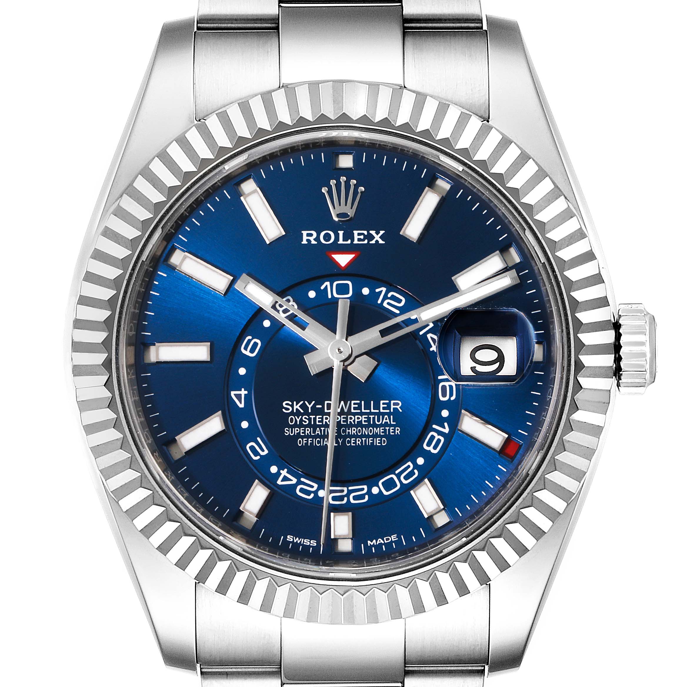 The Sky-Dweller by Rolex is shown from a frontal angle, highlighting its blue dial, fluted bezel, and date window.