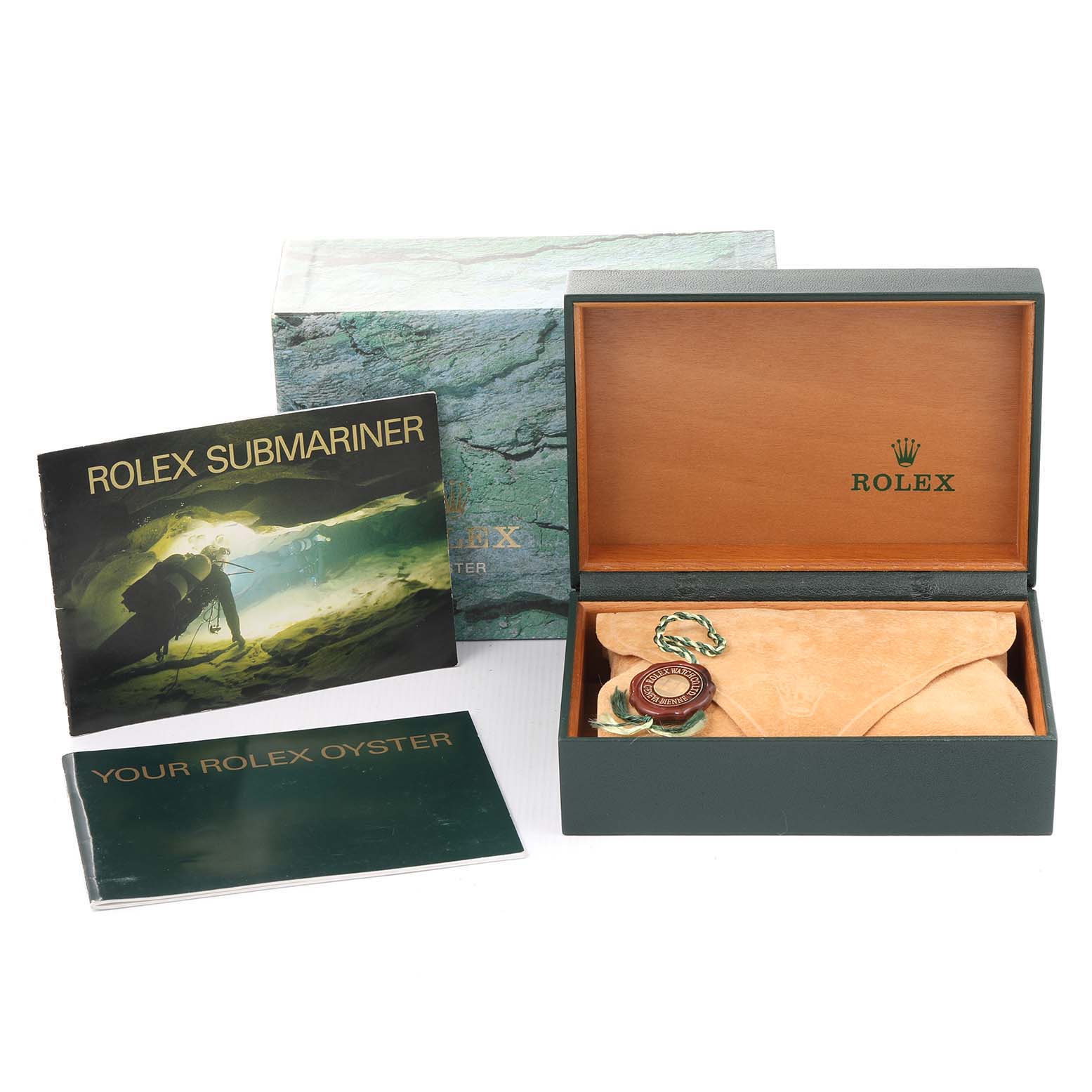 The image shows a Rolex Submariner 14060 Men
s Stainless Steel Black Dial 14060 Men
s Stainless Steel Black Dial watch box, manuals, and accessories from a front angle.