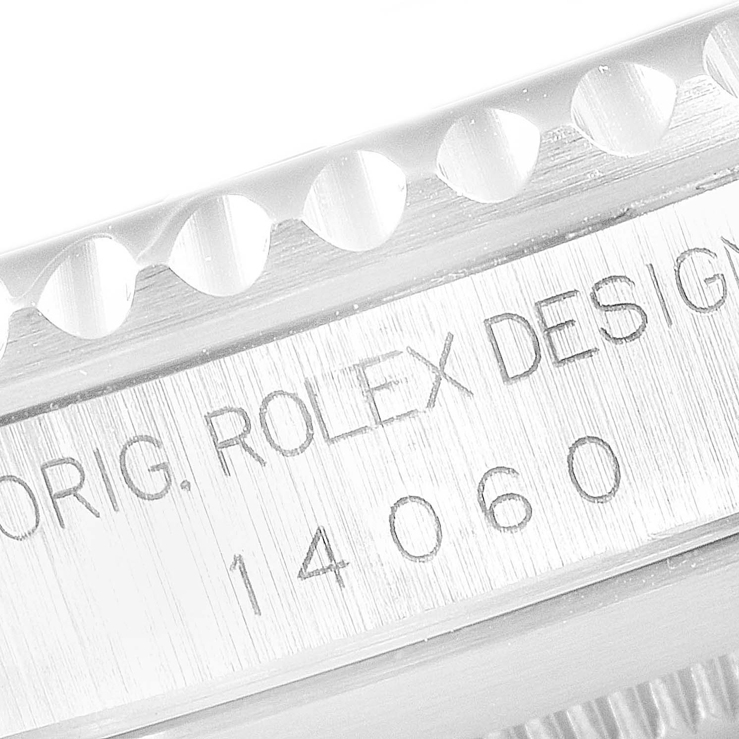 This image shows a close-up of the side engraving and bezel teeth of a Rolex Submariner 14060 Men
s Stainless Steel Black Dial 14060 Men
s Stainless Steel Black Dial 14060 model.