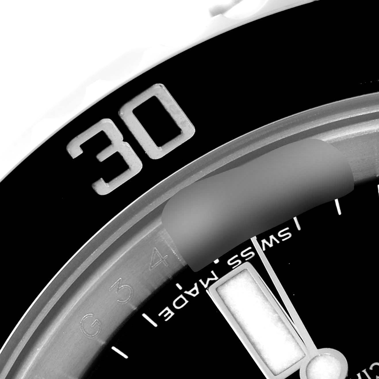 The image shows a close-up of the 30-minute mark on the bezel and part of the dial with a hand of the Rolex Submariner 116610 Men's Stainless Steel Black Dial 116610 Men's Stainless Steel Black Dial model.
