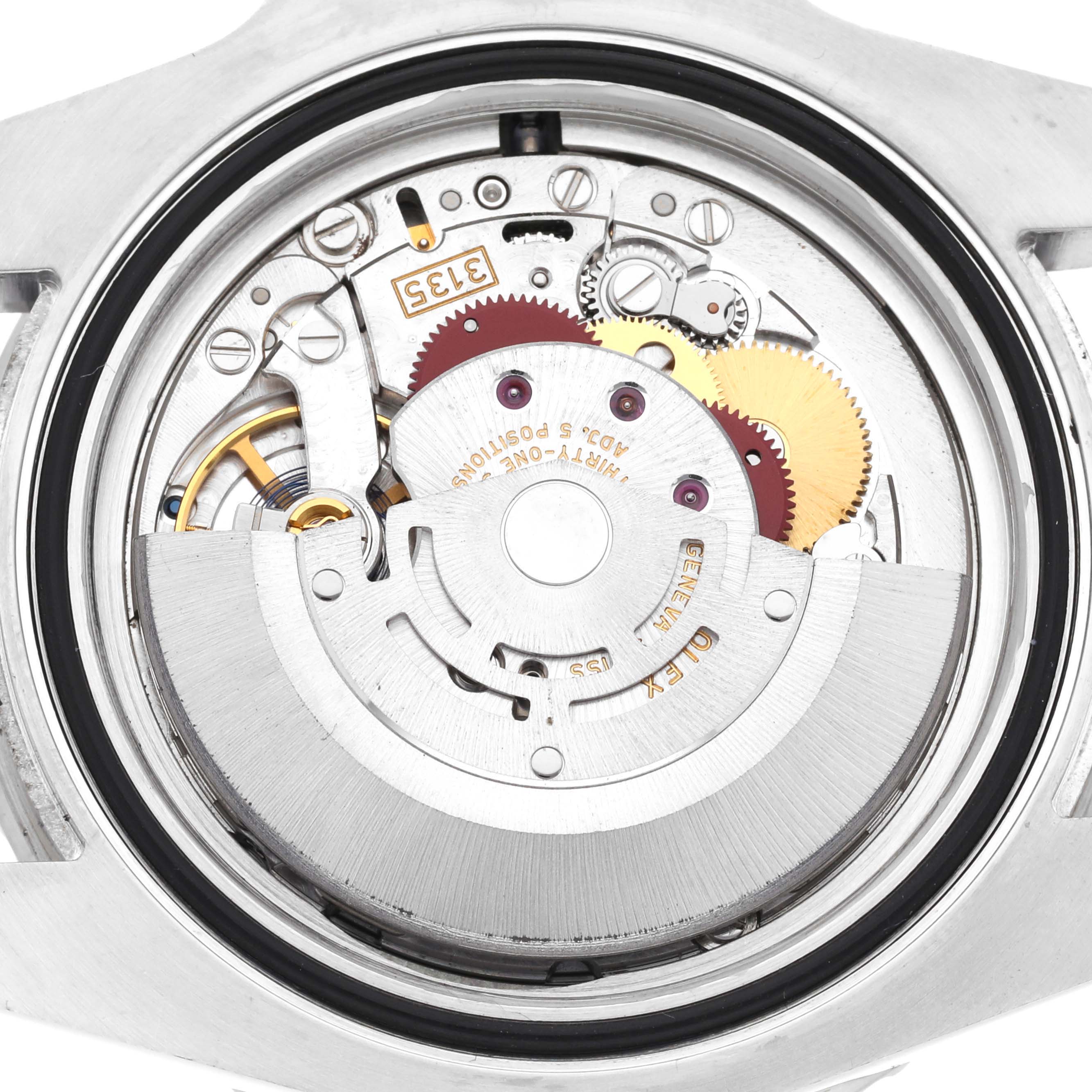 This image shows the inner mechanism and movement of a Rolex Submariner 116610LV Men's Stainless Steel Green Dial 116610LV Men's Stainless Steel Green Dial watch from a top-down angle.