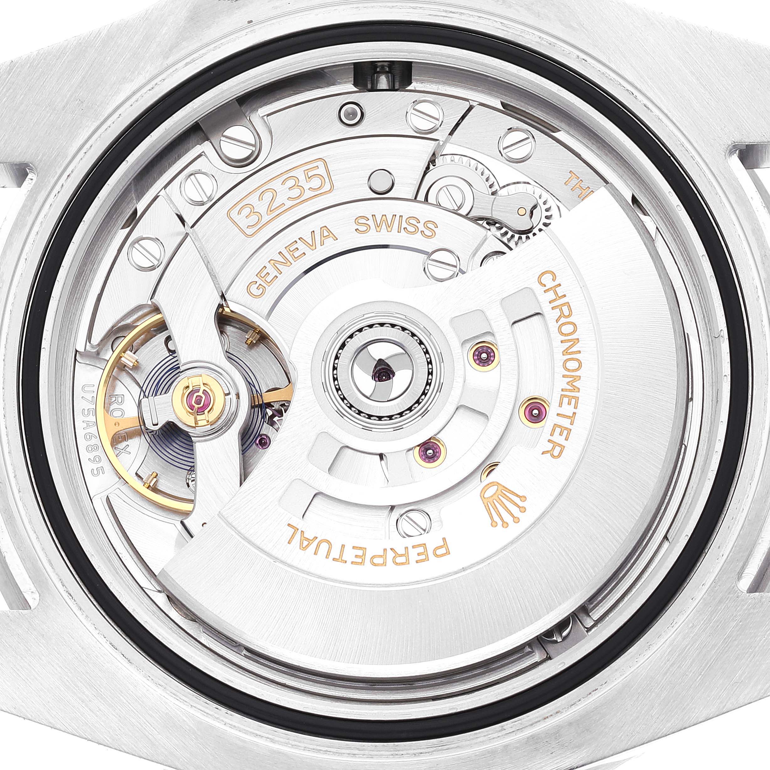 This image shows the movement mechanism of a Rolex Submariner 126610LV Men's Stainless Steel Black Dial 126610LV Men's Stainless Steel Black Dial watch from a close-up, top-down angle.