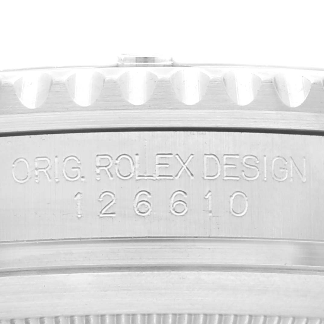 This image shows a close-up of the case side of the Rolex Submariner 126610LV Men's Stainless Steel Black Dial 126610LV Men's Stainless Steel Black Dial, displaying its model number 126610 and the "ORIG. ROLEX DESIGN" engraving.