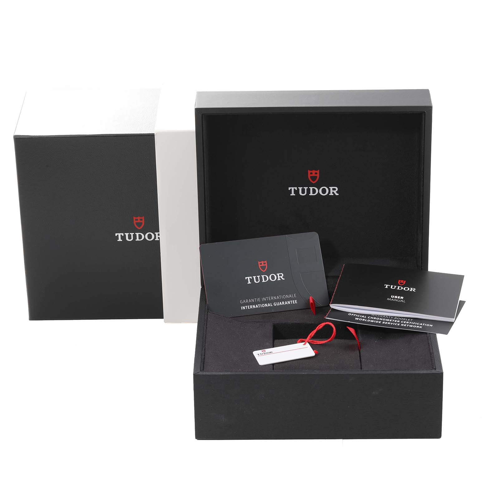 This image shows the packaging, warranty card, and manual for the Tudor Heritage Black Bay 79833MN Men
s Stainless Steel Black Dial 79833MN Men
s Stainless Steel Black Dial watch.