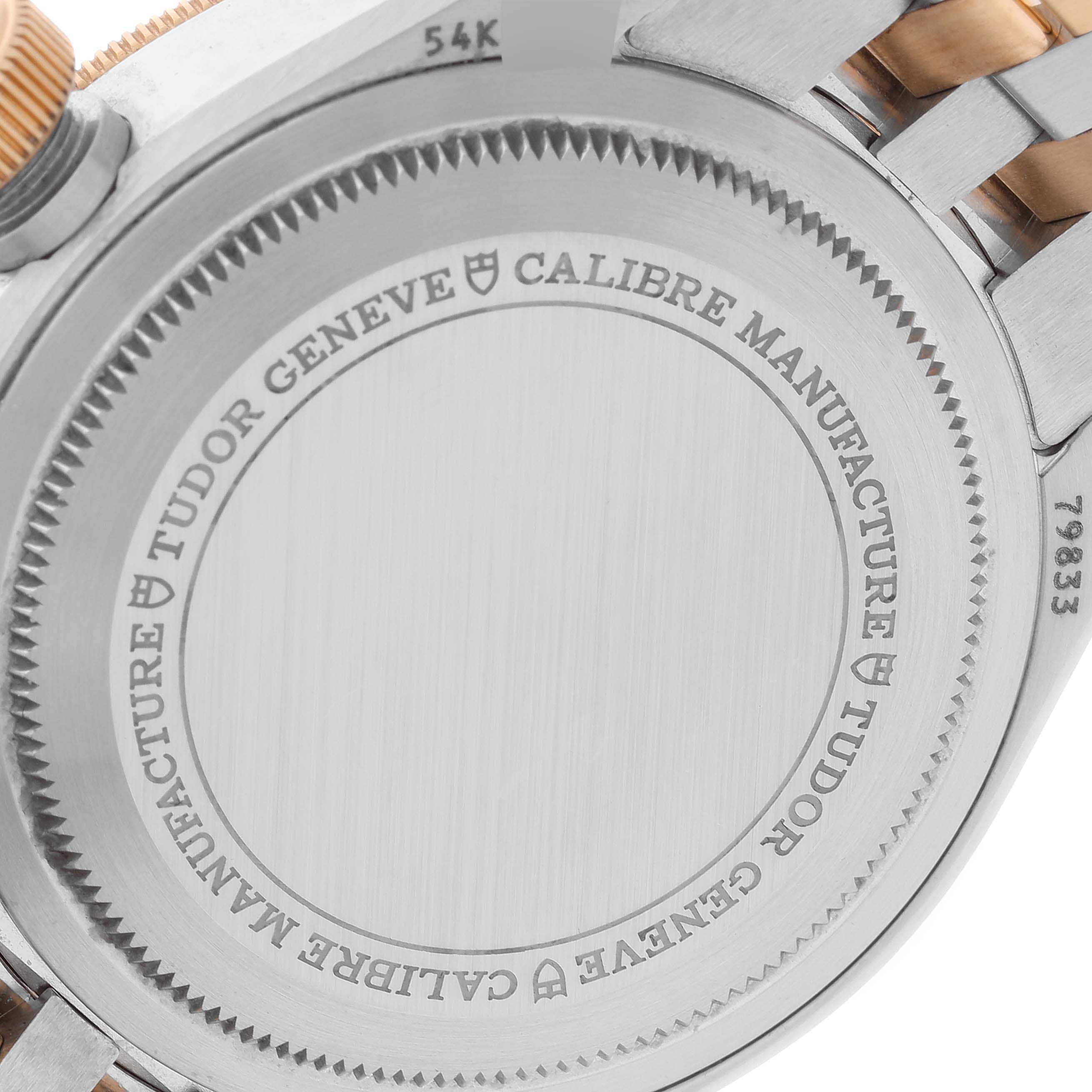 The image shows the back case of the Heritage Black Bay watch by Tudor, featuring the inscriptions and part of the bracelet.