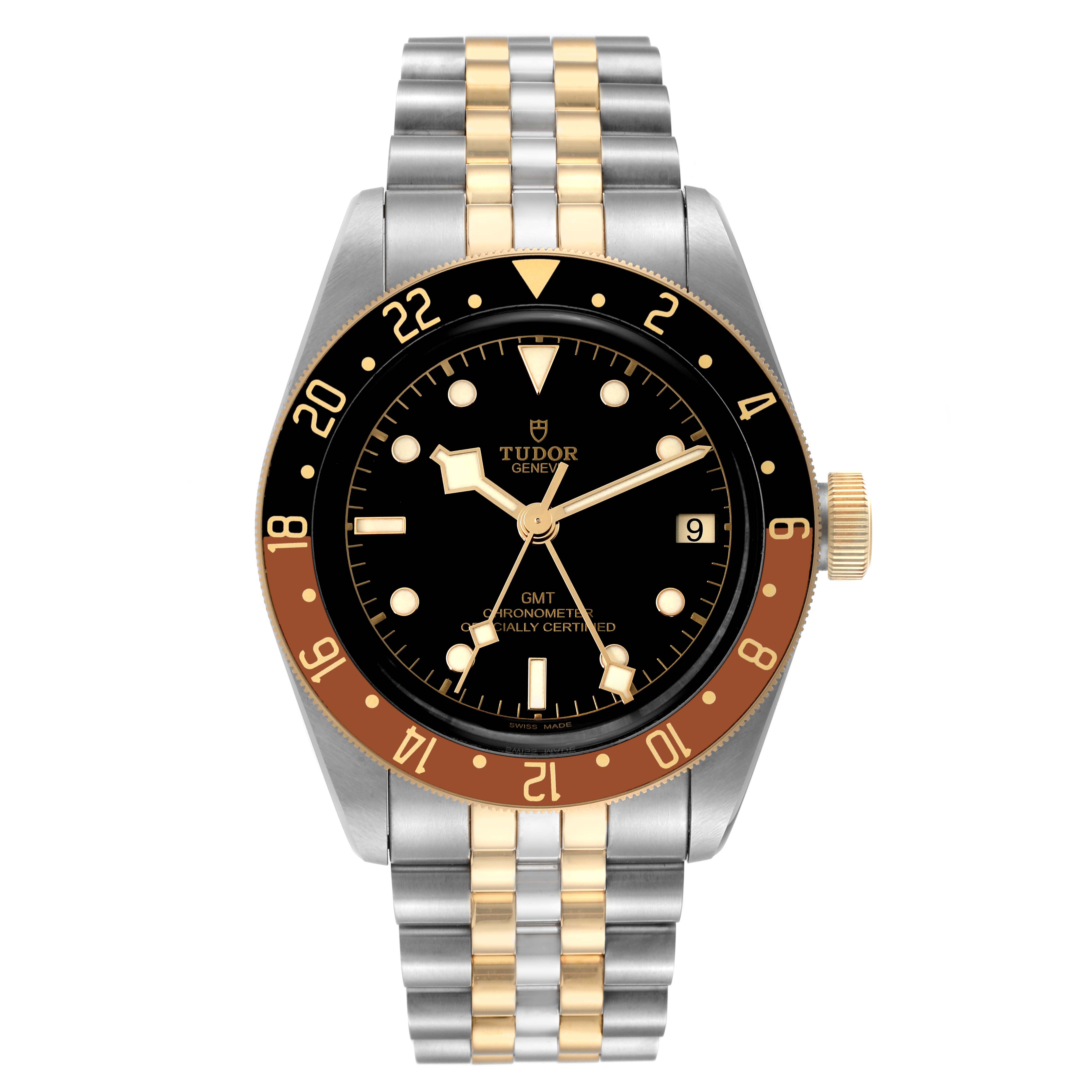 The image shows a front view of a Tudor Heritage Black Bay 79833MN Men
s Stainless Steel Black Dial 79833MN Men
s Stainless Steel Black Dial watch featuring a black dial, date window, and two-tone bracelet.