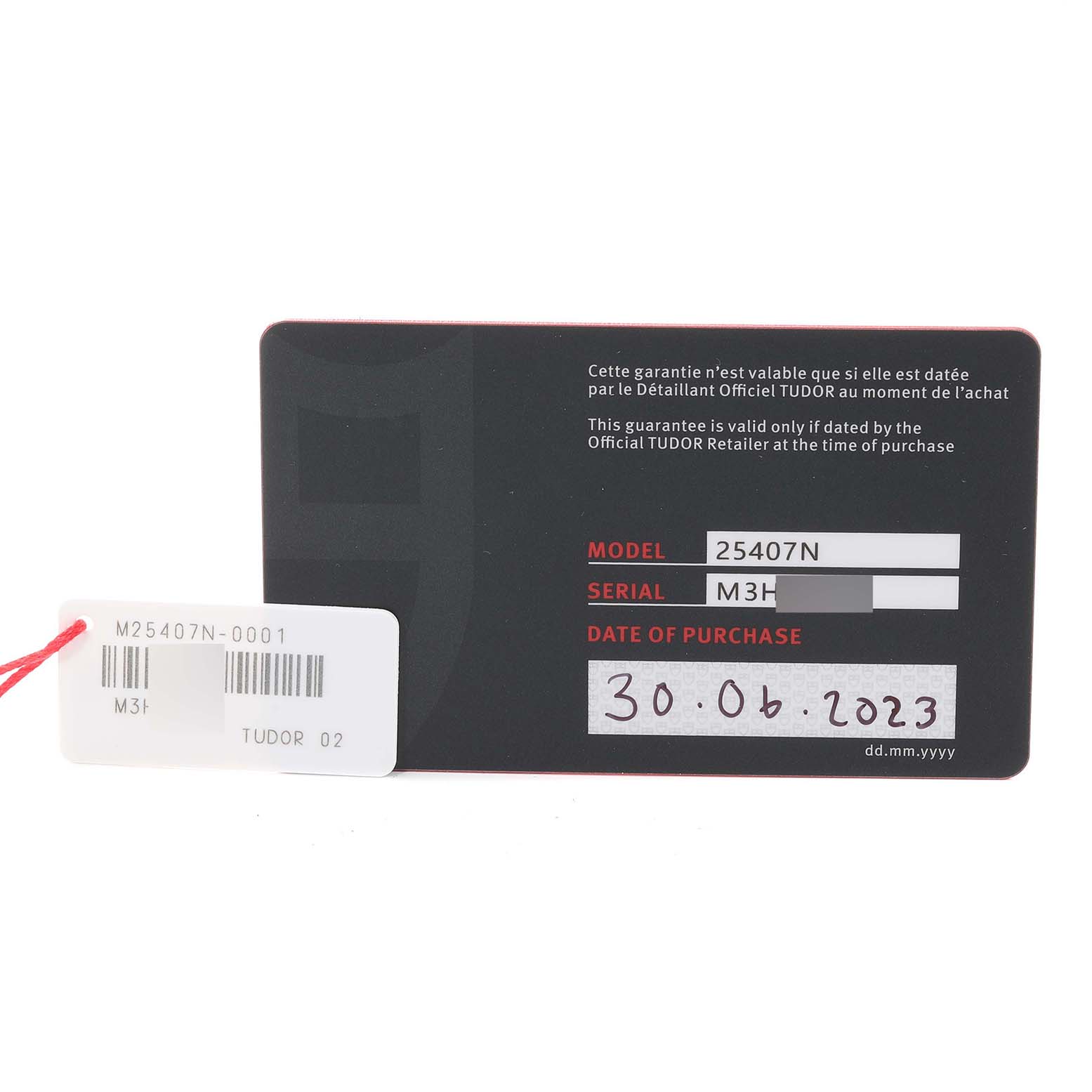 This image shows the warranty card for a Tudor Pelagos 25407N Men
s Titanium Black Dial 25407N Men
s Titanium Black Dial model 25407N watch with the date of purchase and serial number visible.