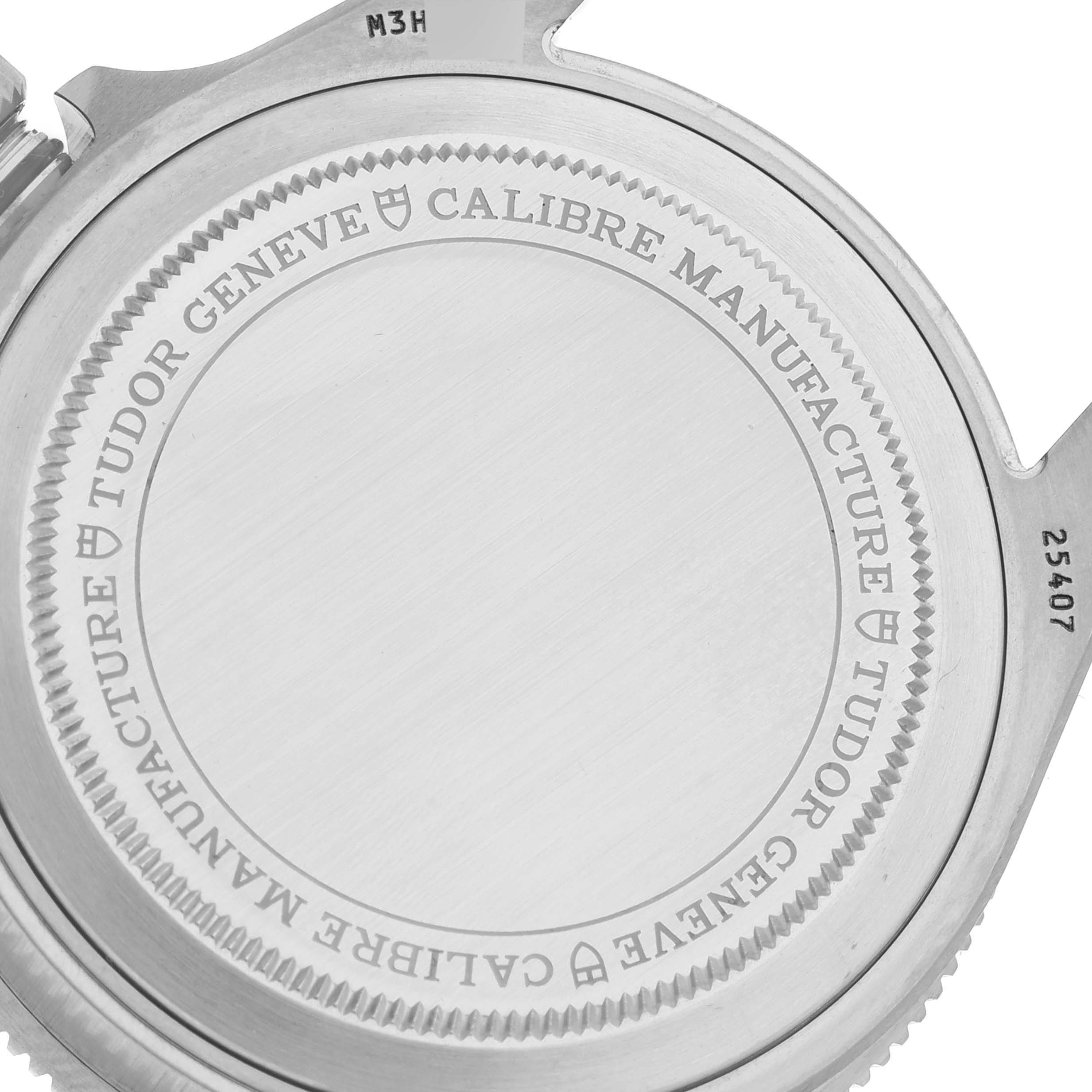 The image shows the case back of the Tudor Pelagos 25407N Men
s Titanium Black Dial 25407N Men
s Titanium Black Dial watch from an angled side view.