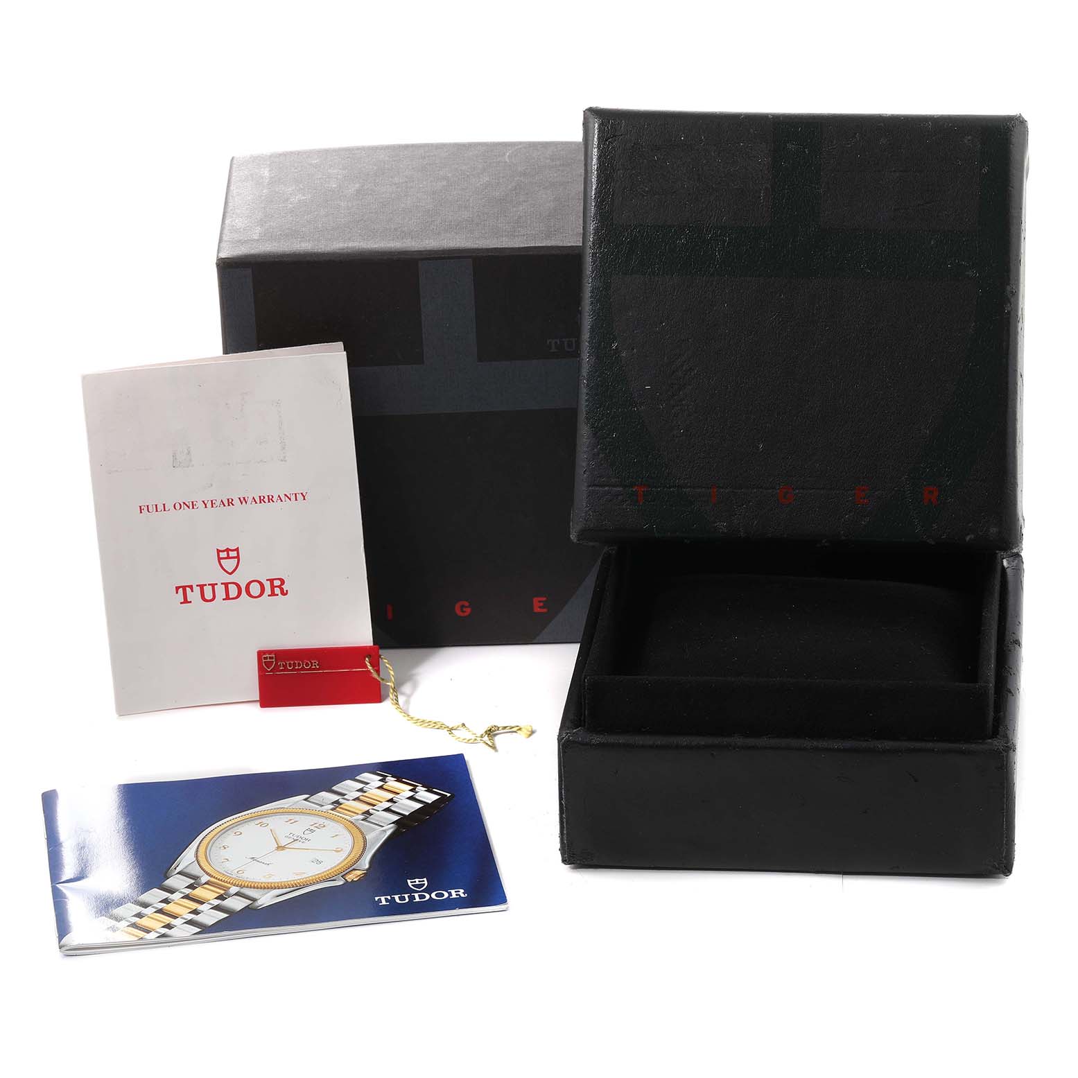 This image shows the packaging, warranty card, and booklet of the Tudor Prince model.