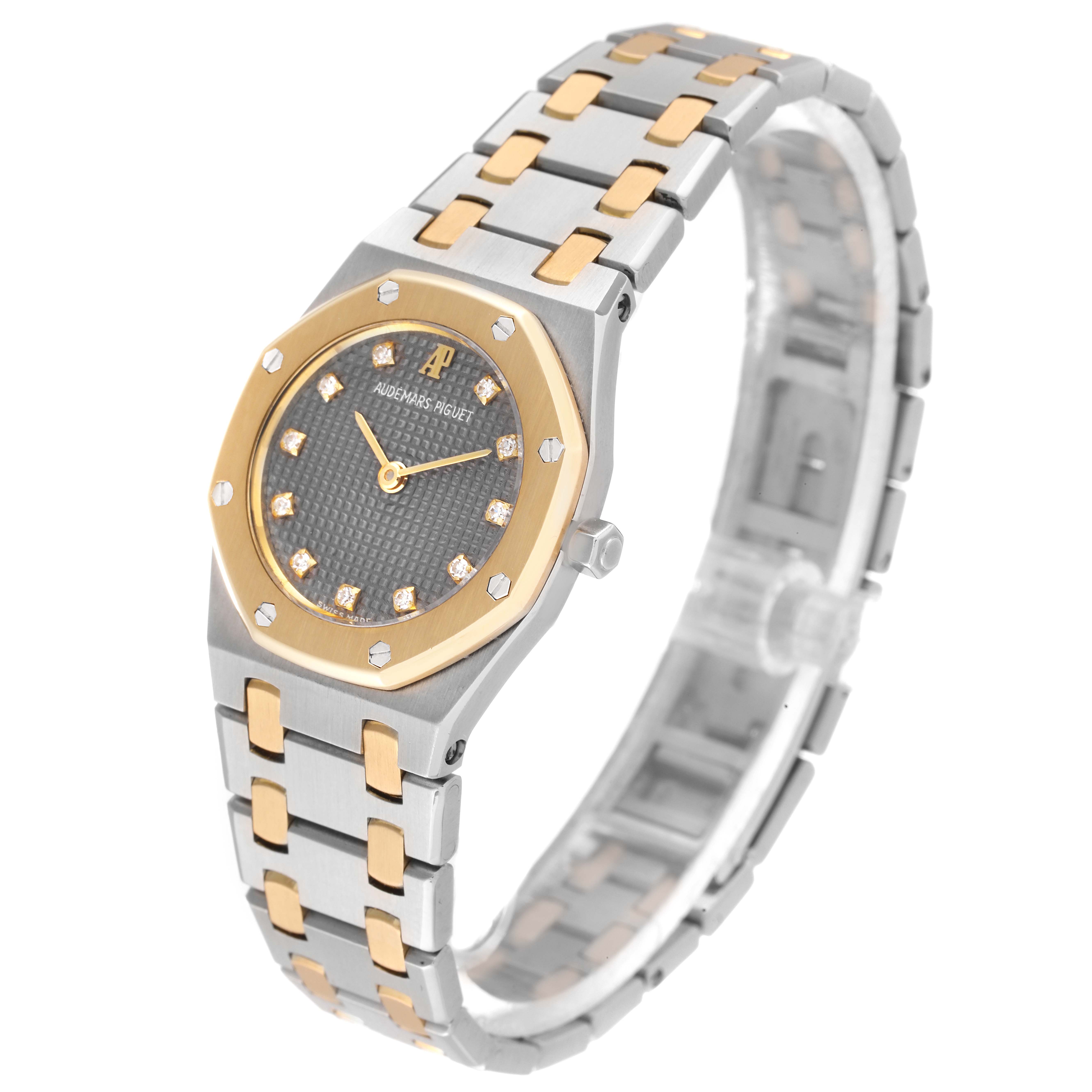 The image shows an Audemars Piguet Royal Oak N1553 Women's Steel and Gold (two tone) Grey Dial N1553 Women's Steel and Gold (two tone) Grey Dial watch at a three-quarter angle, highlighting its dial, bezel, and bracelet.
