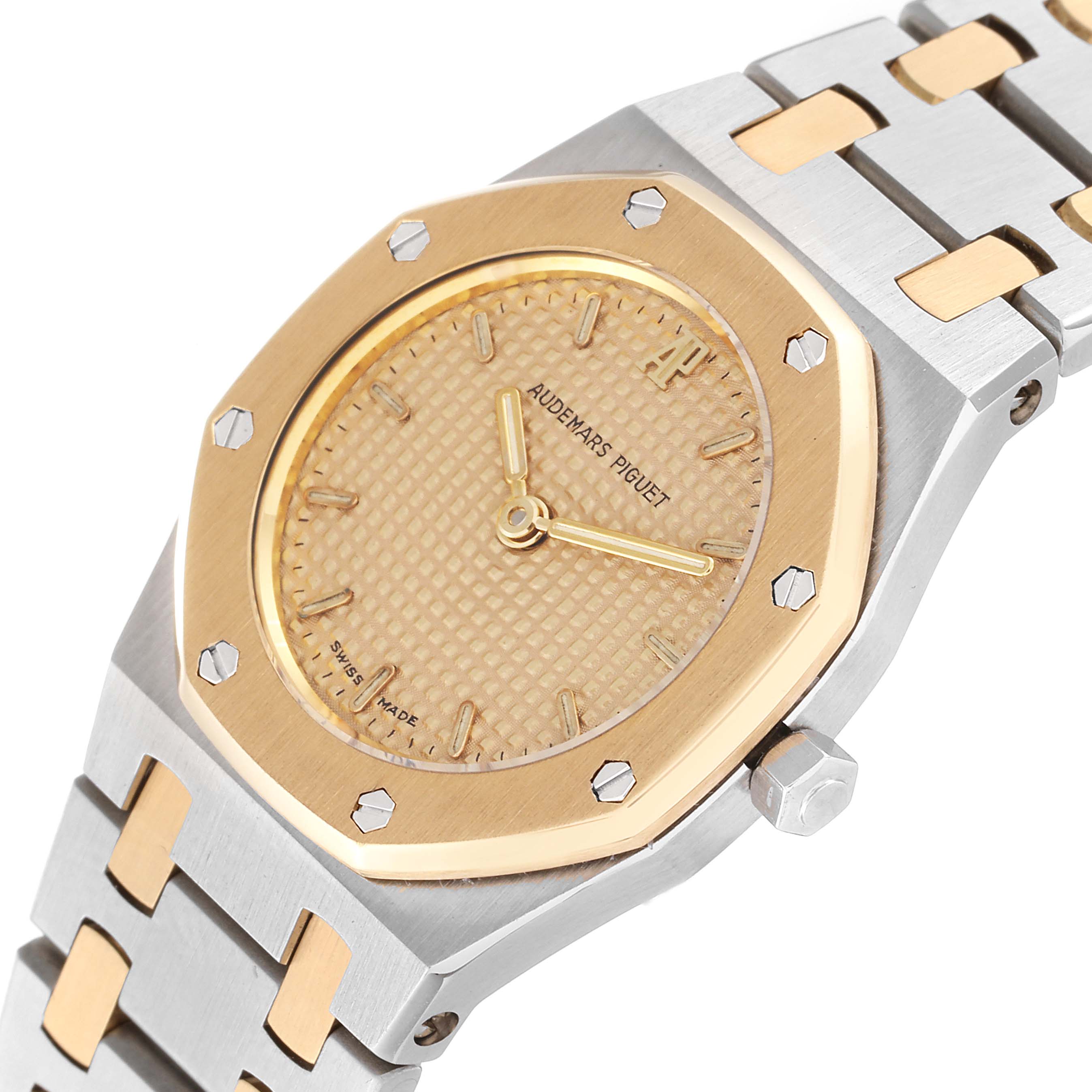 The image showcases an angled view of the Audemars Piguet Royal Oak N2354 Women's Steel and Gold (two tone) Champagne Dial N2354 Women's Steel and Gold (two tone) Champagne Dial, highlighting the dial, bezel, and part of the bracelet.