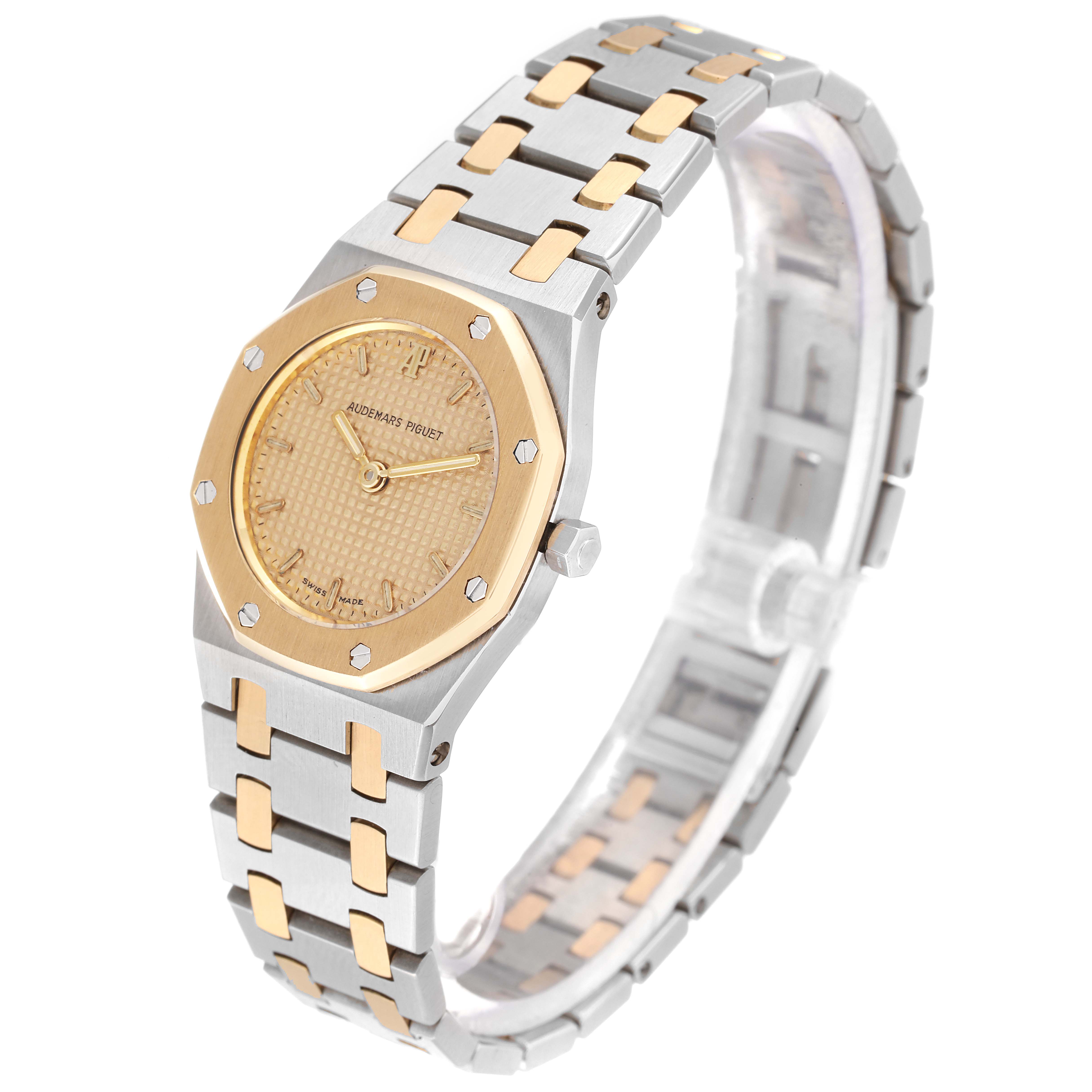 The image shows a side angle of an Audemars Piguet Royal Oak N2354 Women's Steel and Gold (two tone) Champagne Dial N2354 Women's Steel and Gold (two tone) Champagne Dial watch, highlighting its two-tone bracelet and octagonal bezel.