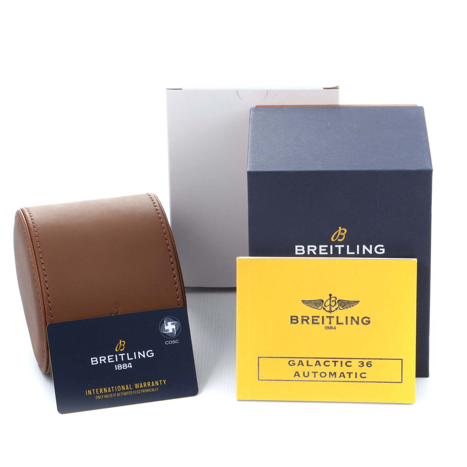 The image shows packaging and accessories for a Breitling A37330 Women's Stainless Steel Mother of Pearl Dial A37330 Women's Stainless Steel Mother of Pearl Dial Galactic 36 MOP Dial Diamond Steel Ladies Watch A37330, including the box, warranty card, and manual.