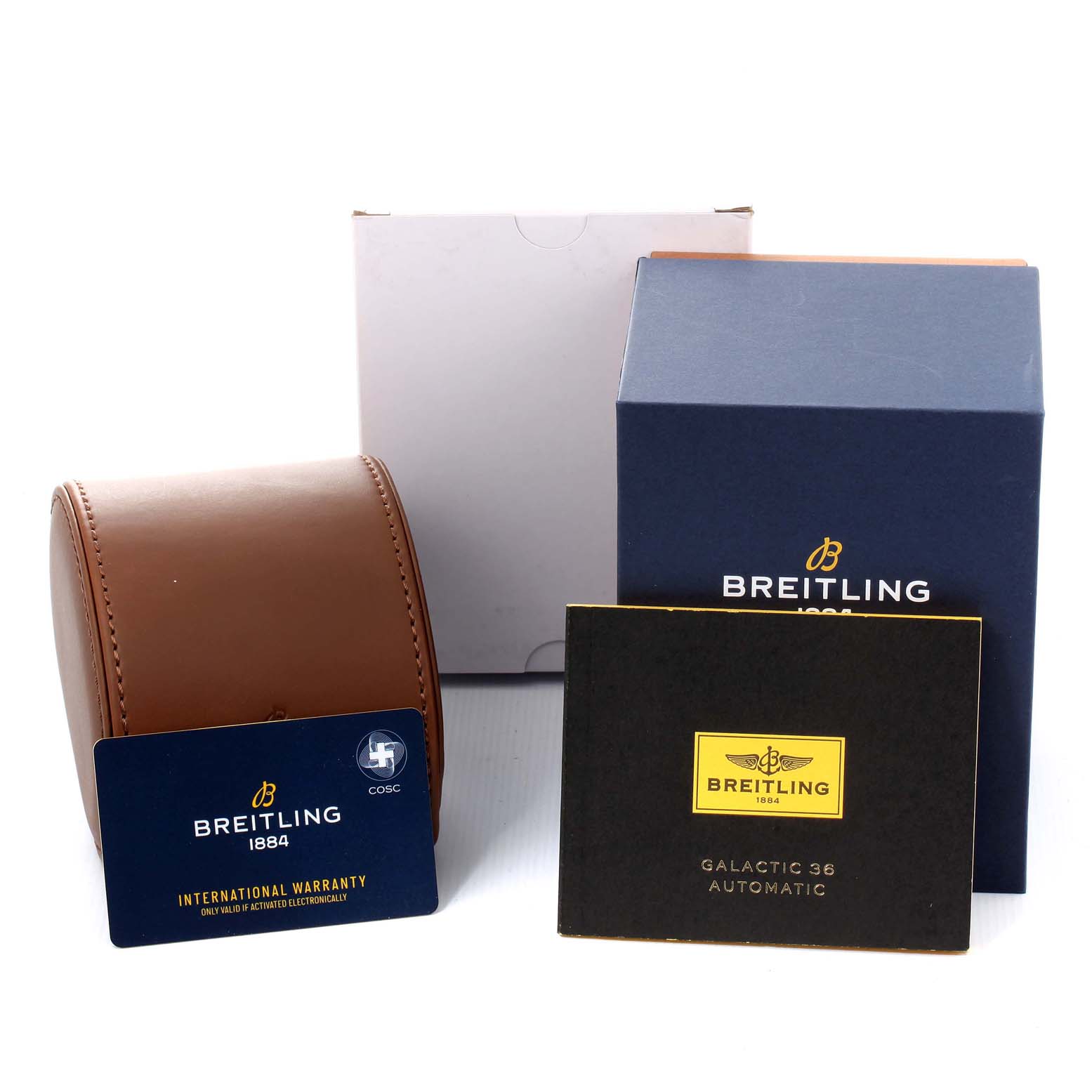 The image shows accessories of the Breitling A37330 Women's Stainless Steel Mother of Pearl Dial A37330 Women's Stainless Steel Mother of Pearl Dial Galactic 36 MOP Dial Diamond Steel Ladies Watch A37330, including a box, warranty card, and booklet.