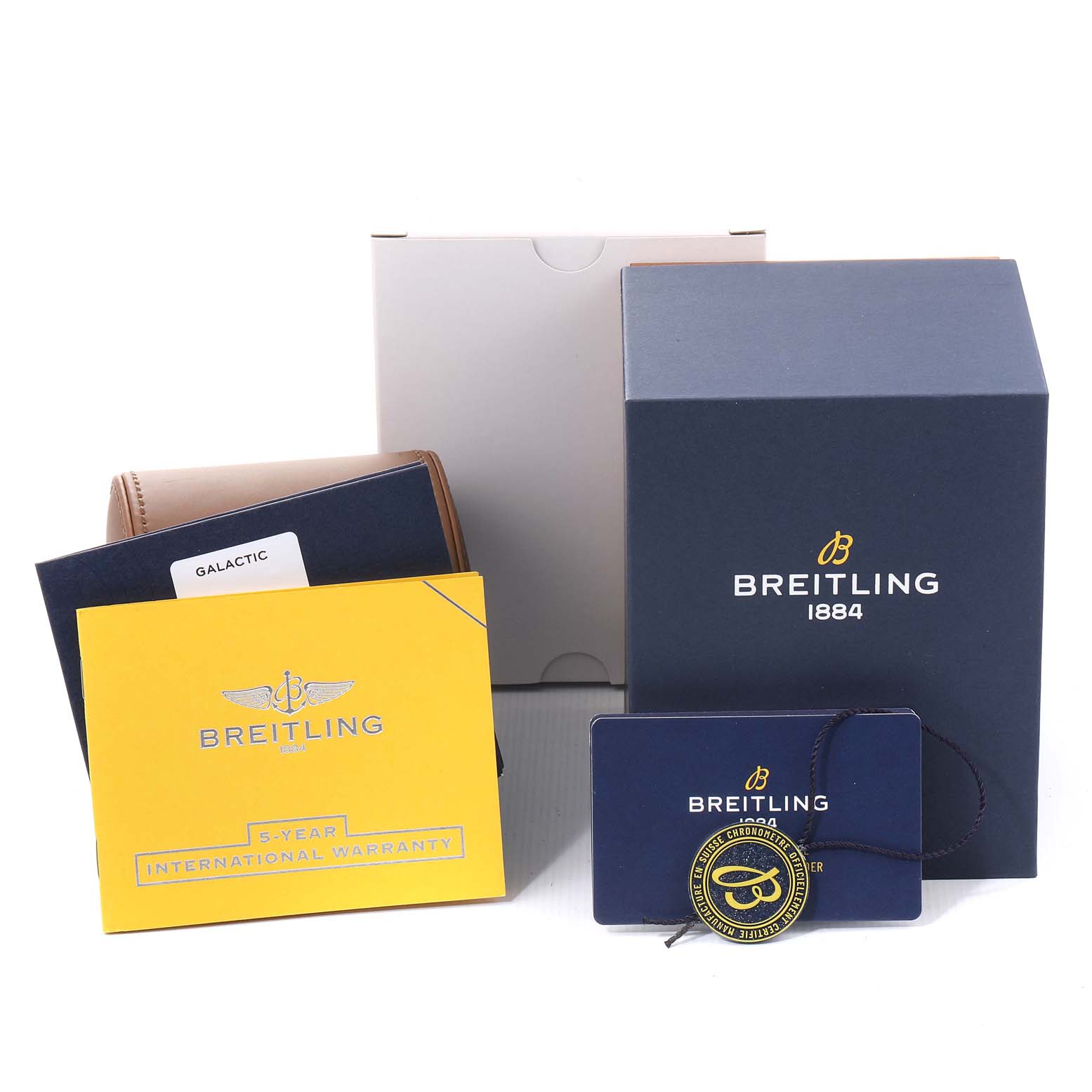 The image shows the packaging and accessories for the Breitling A37330 Women's Stainless Steel Silver Dial A37330 Women's Stainless Steel Silver Dial Galactic 36 Silver Dial Steel Ladies Watch A37330, including warranty and tags.