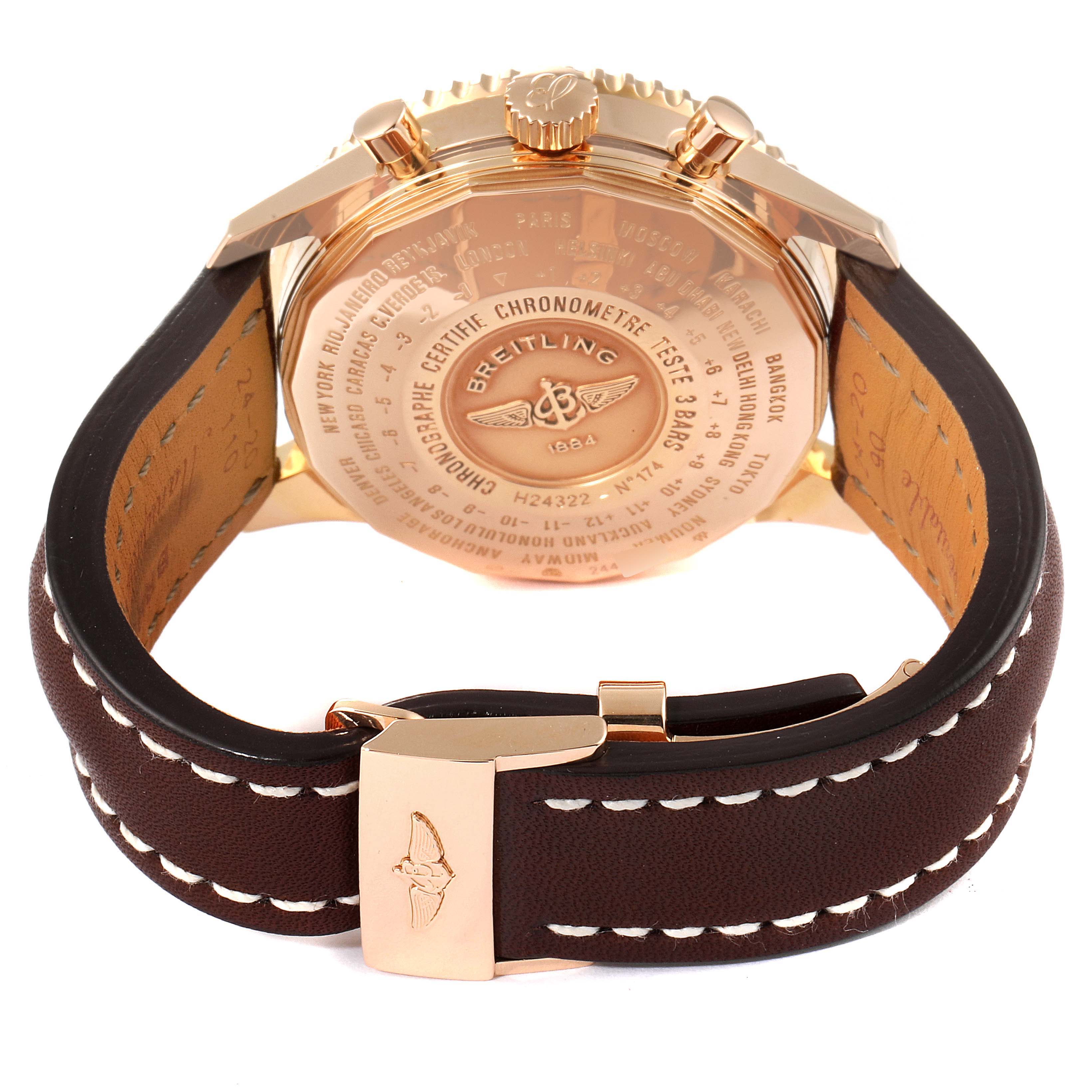 The image shows the back view and clasp of a Breitling Navitimer H24322 Men
s Rose Gold Black Dial H24322 Men
s Rose Gold Black Dial watch with a brown leather strap.